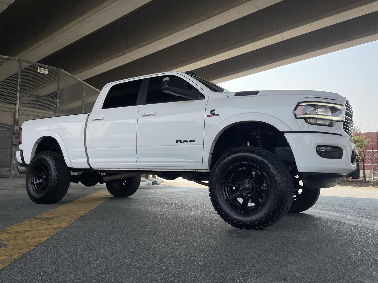 <p>CHECK THIS OUT!! 6 BDS SUSPENSION LIFT, FOX 2.0 SHOCKS, 20 FUEL WHEELS, 37x13.50R20 FALKEN WILDPEAK A/T TIRES, BD PERFORMANCE EXHAUST With Tuning, BD TOWMASTER 68RFE TRANSMISSION UPGRADE, Tri Folding Tonno Cover. Just A Beauty of a truck!</p><h1 class=b-main-title h3  quick-add-hidden data-product-title-id=7625607774262>&nbsp;</h1><p>&nbsp;&nbsp;</p><p>RAM 3500 LARAMIE CREW CAB 4X4&nbsp;<br>Exterior Color: Bright White Interior Color: Black interior / Black seats&nbsp;<br>Interior: Leather&ndash;faced front vented front bucket seats&nbsp;<br>Engine: 6.7L Cummins I&ndash;6 turbocharged diesel engine Transmission: 6&ndash;speed automatic transmission&nbsp;<br>STANDARD EQUIPMENT (UNLESS REPLACED BY OPTIONAL EQUIPMENT)<br>Remote proximity keyless entry<br>Push&ndash;button start<br>Electronic shift&ndash;on&ndash;the&ndash;fly transfer case<br>Security alarm<br>Remote start system<br>Dampened tailgate<br>ParkView Rear Back&ndash;Up Camera<br>Park&ndash;Sense Front and Rear Park Assist System<br>4&ndash;wheel anti&ndash;lock disc brakes<br>Brake Assist<br>Ready Alert Braking<br>Hill Start Assist<br>Advanced multistage front air bags<br>Supplemental side air bags<br>Supplemental front seat&ndash;mounted side air bags<br>Supplemental side curtain air bags<br>Front heated seats<br>Heated steering wheel<br>Power adjustable pedals<br>A/C with dual&ndash;zone automatic temperature control<br>7&ndash;inch full&ndash;colour customizable in&ndash;cluster display<br>Uconnect 4 with 8.4&ndash;inch display<br>Hands&ndash;free communication with Bluetooth streaming<br>9 Alpine speakers with subwoofer<br>Google Android Auto<br>Apple CarPlay capable<br>SiriusXM satellite radio with 1&ndash;year subscription<br>Power 8&ndash;way adjustable driver seat<br>Power 8&ndash;way adjustable front passenger seat<br>Automatic headlamps<br>LED reflector headlamps<br>LED taillamps<br>LED fog lamps<br>Anti&ndash;spin differential rear axle<br>Electronic Stability Control<br>Traction Control<br>Front heavy&ndash;duty shock absorbers<br>Rear heavy&ndash;duty shock absorbers<br>Class V hitch receiver<br>4&ndash;pin wiring harness<br>7&ndash;pin wiring harness<br>Sentry Key Theft Deterrent System<br>Electronic Roll Mitigation<br>Trailer Sway Control<br>3.73 rear axle ratio<br>Engine block heater<br>Cruise control<br>Media hub w/ 2 USB ports and auxiliary input jack<br>OPTIONAL EQUIPMENT (May Replace Standard Equipment)<br>Leather&ndash;faced front vented front bucket seats $1,400<br>Ramcharger wireless charging pad&nbsp;<br>Customer Preferred Package 2HH&nbsp;<br>Night Edition $2,995<br>Black, power, tow spotter mirrors with memory&nbsp;<br>Black rams head tailgate badge&nbsp;<br>Grille with Gloss Black billets and accents&nbsp;<br>LT285/60R20E OWL On&ndash;/Off&ndash;Road tires&nbsp;<br>20x8&ndash;inch Black aluminum wheels&nbsp;<br>Black wheel centre hub&nbsp;<br>Laramie Level 2 Equipment Group $3,195<br>Front ventilated seats&nbsp;<br>Bright, power, tow spotter mirrors with memory&nbsp;<br>Rain&ndash;sensing windshield wipers&nbsp;<br>Remote tailgate release&nbsp;<br>Second&ndash;row heated seats&nbsp;<br>Radio, driver seat, mirrors & pedals memory setting&nbsp;<br>Power, convex auxiliary exterior mirrors&nbsp;<br>Automatic high&ndash;beam headlamp control&nbsp;<br>17&ndash;speaker high performance audio&nbsp;<br>1&ndash;year SiriusXM Guardian subscription&nbsp;<br>SiriusXM Travel Link with 5&ndash;year subscription&nbsp;<br>SiriusXM Traffic with 5&ndash;year subscription&nbsp;<br>4G LTE Wi&ndash;Fi hot spot&nbsp;<br>Uconnect 4C NAV with 8.4&ndash;inch display&nbsp;<br>Power adjustable pedals with memory&nbsp;<br>Blind&ndash;Spot and Cross&ndash;Path Detection (Truck only)&nbsp;<br>6&ndash;speed automatic transmission $2,155<br>6.7L Cummins I&ndash;6 turbocharged diesel engine $7,295<br>220&ndash;amp alternator&nbsp;<br>Power sunroof $1,425<br>Federal A/C Excise Tax $100</p>