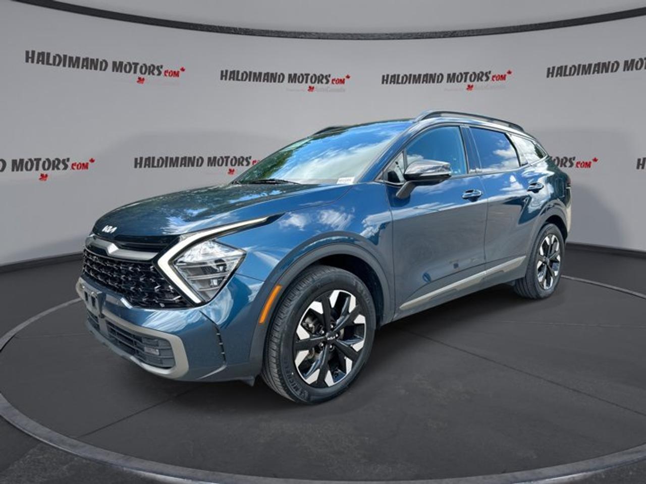 // ACCIDENT FREE!! //<br />// SINGLE OWNER! //<br /><br />This 2023 Kia Sportage X-Line Limited AWD is a well-kept, accident-free SUV with one owner and 45,064 km. Finished in blue with a black interior, it blends sharp style, everyday comfort, and confident all-wheel drive for life in Cayuga and beyond.<br /><br />With its 2.5-litre gas engine and 8-speed automatic transmission, this used 2023 Kia Sportage X-Line Limited AWD delivers smooth power for commuting, errands, and weekend travel. Four doors, a roomy cabin, and a versatile cargo area make it a practical fit for busy families and active drivers.<br /><br />FEATURES OF THE Sportage X-Line Limited AWD | One Owner | No Accidents<br />   Panoramic sunroof brightens the spacious cabin<br />   Heated and ventilated front seats included<br />   Heated rear seats add winter comfort<br />   Navigation and 360-degree camera enhance confidence<br /><br />ADVANCED SAFETY FEATURES<br />   Backup camera helps with tight parking<br />   Blind spot monitor adds lane awareness<br />   Lane departure warning supports safer travel<br />   Stability control helps maintain road grip<br /><br />PERFORMANCE AND EFFICIENCY<br />   2.5-litre gas engine delivers smooth response<br />   8-speed automatic supports relaxed highway cruising<br />   All-wheel drive adds year-round confidence<br />   Dual shift mode offers added control<br /><br />COMFORT AND CONVENIENCE<br />   Dual-zone climate control keeps comfort balanced<br />   Heated steering wheel warms cold mornings<br />   Remote starter adds everyday seasonal ease<br />   Power liftgate simplifies cargo area access<br /><br />TECHNONOLGY AND CONNECTIVITY<br />   Apple CarPlay connects favourite mobile apps<br />   Android Auto adds easy smartphone integration<br />   Bluetooth integration supports hands-free communication<br />   Navigation system helps guide every trip<br /><br />CARGO SPACE<br />   Rear trunk access makes loading simple<br />   Power liftgate helps with daily errands<br />   Four-door layout improves passenger entry ease<br />   Spacious design suits groceries and gear<br /><br />AWARDS & RECOGNITIONS<br />   Top Safety Pick, Insurance Institute for Highway Safety, 2023<br /><br />WHAT OTHER OWNERS LIKE<br />   Comfortable ride quality for daily driving<br />   User-friendly infotainment and easy connectivity<br />   Spacious cabin with practical family versatility<br />   Strong feature content for the value<br /><br />Inside, this Kia feels upscale and welcoming. You get leather seats, memory seats, a power drivers seat with lumbar support, a power passenger seat, front air conditioning, automatic climate control, and ambient lighting. The panoramic sunroof adds an open feel that makes every drive more enjoyable.<br /><br />Convenience is strong throughout the cabin. Push-button start, cruise control, power steering, power windows, heated mirrors, electric mirrors, remote trunk release, tinted windows, and an adjustable steering wheel all help make each trip easier. Automatic headlights and fog lights also help when weather and road conditions change.<br /><br />Technology is another highlight. This SUV includes a navigation system, satellite radio, HD Radio, steering wheel audio controls, Apple CarPlay, Android Auto, and Bluetooth integration. The 360-degree camera and auto-dimming rearview mirror help support better visibility in busy parking lots and tight spaces.<br /><br />This Sportage also brings welcome cold-weather comfort. Heated front seats, ventilated front seats, heated rear seats, and a heated steering wheel help everyone stay comfortable through changing Ontario seasons. Rear window defroster and turn signal mirrors add even more daily usefulness.<br /><br />Safety equipment includes Anti-Lock Braking System, driver and passenger airbags, side impact airbags, head side airbags, child safety locks, tire pressure monitoring, adaptive cruise control, and a passenger airbag sensor. These features help make this Kia a smart choice for drivers who value confidence behind the wheel.<br /><br />This 2023 Kia Sportage X-Line Limited AWD | One Owner | No Accidentss VIN is: KNDPXCAF3P7160261.<br /><br />WHY CHOOSE US? <br /><br />Honest & Transparent Buying Experience: Weve been a trusted name in business since 1984.<br /><br />STRAIGHTFORWARD PRICING:<br />Our Advertised Price Includes:<br />>>Safety Certification (No separate fee!)<br />>>30-Day 100% Mechanical Warranty<br />>>FREE Carfax History Report.<br />>>No upcharge for paying cash.<br />(Prices Exclude HST and Licensing Fees only.)<br /><br />>>Browse 300+ vehicles all in ONE LOCATION<br /><br />EASY FINANCING: Great rates & open loans<br /><br />WE BUY CARS: Get Top Dollar for your trade-in, or sell us your vehicle for CASH! Even if you dont buy from us!<br /><br />STOP BY TODAY<br />Treat yourself - stop by Haldimand Motors Ltd. located at 42 Talbot St E, Cayuga, ON N0A 1E0 to make this car yours today!<br /><br />https://www.haldimandmotors.com/used/stock-461089.html