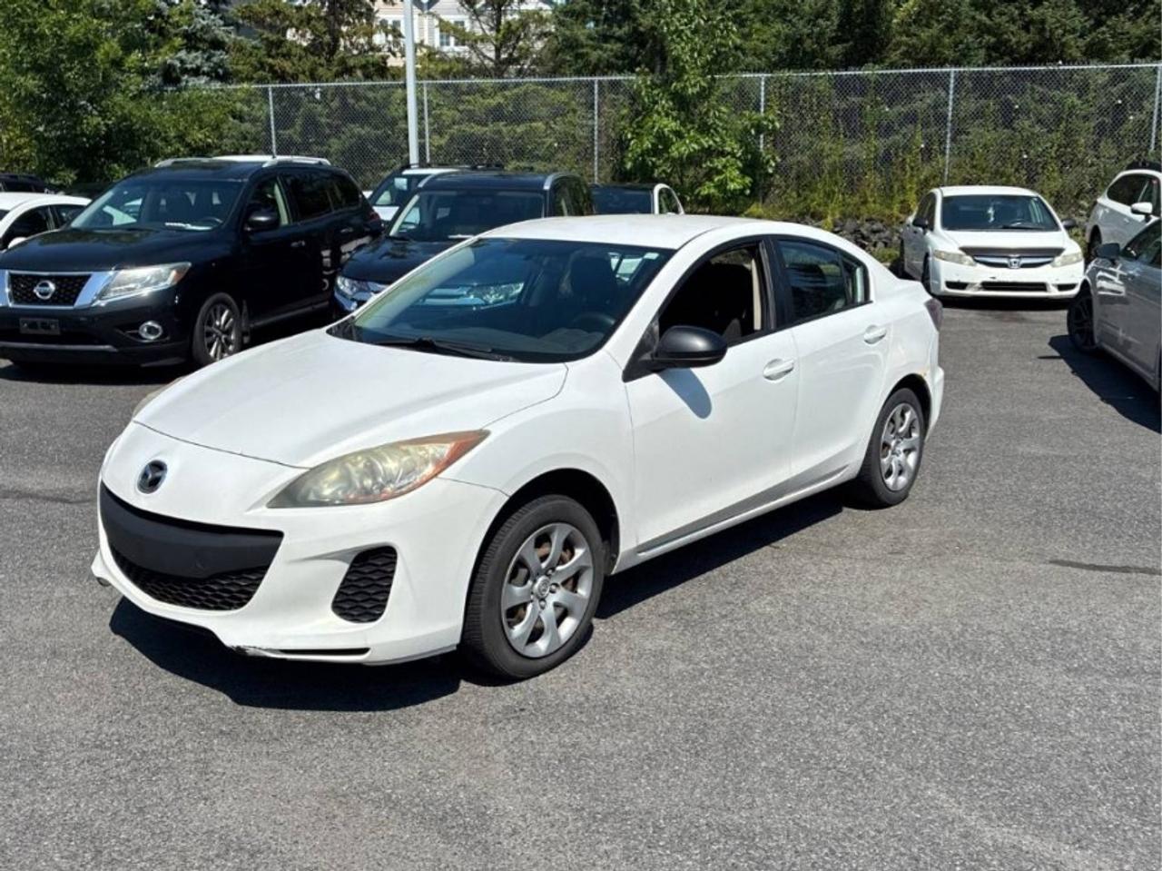 ** ** SPECIAL LIMITED TIME OFFER ** ** PURCHASE ANY VEHICLE THIS WEEK AND RECEIVE 4 BRAND-NEW ALL-SEASON TIRES AT NO ADDITIONAL COST!!! DONT MISS THIS EXCLUSIVE CHANCE TO UPGRADE YOUR RIDE AND STAY PREPARED FOR ANY WEATHER!!!       EXCITING NEWS FROM FIRST CHOICE MOTORS! Our brand-new online showroom is now open to the public, bringing the ultimate car shopping experience right to your fingertips! Enjoy a 100% online car shopping experience, with over 500 certified vehicles in stock, comprehensive protection plans, and thousands of new auto parts & accessories available! Plus, for a limited time, were offering FREE deliveries across Ontario on all vehicle purchases! Dont miss outvisit Shop.fcmotors.ca to find and upgrade your perfect vehicle today!      Welcome to First Choice Motors, the largest car dealership in Toronto of pre-owned cars, SUVs, and vans priced between $5000-$15,000. With an impressive inventory of over 300 vehicles in stock, we are dedicated to providing our customers with a vast selection of affordable and reliable options.       Were thrilled to offer a used 2012 Mazda MAZDA3 GX, white color with 193,000km (STK#10197) This vehicle was $7490 NOW ON SALE FOR $6990. It is equipped with the following features:   - Manual Transmission   - Power windows   - Power locks   - Power mirrors   - Air Conditioning      At First Choice Motors, we believe in providing quality vehicles that our customers can depend on. All our vehicles come with a 36-day guarantee on all safety related items. We also offer additional warranty options up to 5 years for our customers who want extra peace of mind.      Furthermore, all our vehicles are sold fully certified with brand new brakes rotors and pads, a fresh oil change, and brand new set of all-season tires installed & balanced. You can be confident that this car is in excellent condition and ready to hit the road.      At First Choice Motors, we believe that everyone deserves a chance to own a reliable and affordable vehicle. Thats why we offer financing options with low interest rates starting at 7.9% O.A.C. Were proud to approve all customers, including those with bad credit, no credit, students, and even 9 socials. Our finance team is dedicated to finding the best financing option for you and making the car buying process as smooth and stress-free as possible.      Our dealership is open 7 days a week to provide you with the best customer service possible. We carry the largest selection of used vehicles for sale under $9990 in all of Ontario. We stock over 300 cars, mostly Hyundai, Chevrolet, Mazda, Honda, Volkswagen, Toyota, Ford, Dodge, Kia, Mitsubishi, Acura, Lexus, and more. With our ongoing sale, you can find your dream car at a price you can afford. Come visit us today and experience why we are the best choice for your next used car purchase!      All prices include $22.00 OMVIC Fee.  Excludes, license plates, ownership registration and ONTARIO HST (13%)   *No Credit Card payments can be accepted for Vehicle Purchases*    *No Credit Card payments can be accepted for Vehicle Purchases*