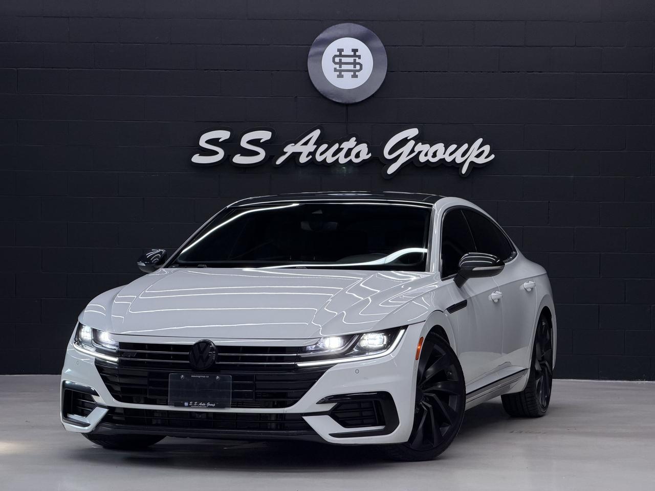<p class=MsoNormal><span style=font-size: 10pt;>EXTENDED WARRANTY PACKAGES AVAILABLE UPTO 4 YEARS UNLIMITED KMS.&nbsp; VEHICLE WITH SERVICE RECORDS - CARFAX REPORT IS VERIFIED AND AVAILABLE UPON REQUEST.</span></p><p class=MsoNormal>&nbsp;</p><p class=MsoNormal><span style=font-size: 10pt;>2019 VOLKSWAGEN ARTEON HIGHLINE R-LINE SEL HAS LANDED.&nbsp; 2.0L 4 CYLINDER PRODUCING OVER 268HP AND 258LB/FT OF TORQUE.&nbsp; WHITE EXTERIOR ON BLACK INTERIOR.&nbsp;&nbsp;FULLY LOADED WITH NAVIGATION, BACKUP CAMERA, PARKING SENSORS, FRONT COLLISION WARNING, ADAPTIVE CRUISE CONTROL, LANE DEPARTURE WARNING, PANORAMIC SUNROOF, HEATED AND COOLED SEATS, REAR HEATED SEATS, HEATED STEERING, PREMIUM DYNAUDIO SOUND SYSTEM, INTERIOR AMBIENT LIGHTING, APPLE CARPLAY & ANDROID AUTO, VOLKSWAGEN DRIVE SELECT, FULL VOLKSWAGEN R-LINE BODY KIT, PREMIUM 20 INCH ROSARIO WHEELS, AUTO LED HEADLIGHTS, BLUETOOTH, COMFORT KEYLESS ACCESS, PUSH BUTTON START AND MUCH MORE.</span></p><p class=MsoNormal>&nbsp;</p><p class=MsoNormal><span style=font-size: 10pt;><strong>CERTIFICATION AVAILABLE FOR AN ADDITIONAL $999 &ndash;&nbsp;</strong>IF NOT CERTIFIED AS PER OMVIC REGULATIONS THE VEHICLE IS DEEMED NOT DRIVABLE AND UNCERTIFIED.&nbsp;&nbsp;THIS FEE WILL ENSURE VEHICLE IS CERTIFIED AND ROAD WORTHY CONDITION. ADVERTISED PRICE EXCLUDES APPLICABLE TAXES, LICENSING, ADMINISTRATIVE, AND FINANCE FEES.</span></p><p class=MsoNormal>&nbsp;</p><p class=MsoNormal><span style=font-size: 10pt;>OUR VEHICLES ARE PRICED TO SELL.&nbsp; DRIVE THIS HOME TODAY!&nbsp;&nbsp;CONTACT US FOR MORE DETAILS.</span></p><p class=MsoNormal>&nbsp;</p><p class=MsoNormal><span style=font-size: 10pt;>S S AUTO GROUP INC.</span></p><p class=MsoNormal><span style=font-size: 10pt;>460 WOODY ROAD</span></p><p class=MsoNormal><span style=font-size: 10pt;>OAKVILLE, ONTARIO L6K 3T6</span></p><p class=MsoNormal>&nbsp;</p><p class=MsoNormal><span style=font-size: 10pt;>CALL: (9 0 5) - 3 3 8 - 7 7 0 7</span></p><p class=MsoNormal><span style=font-size: 10pt;>TEXT: (6 4 7) - 8 8 6 - 8 1 8 2&nbsp; OR&nbsp; (6 4 7) - 5 2 3 - 0 0 6 9</span></p><p class=MsoNormal><span style=font-size: 10pt;>INSTAGRAM: @SSAUTOGROUP_</span></p>