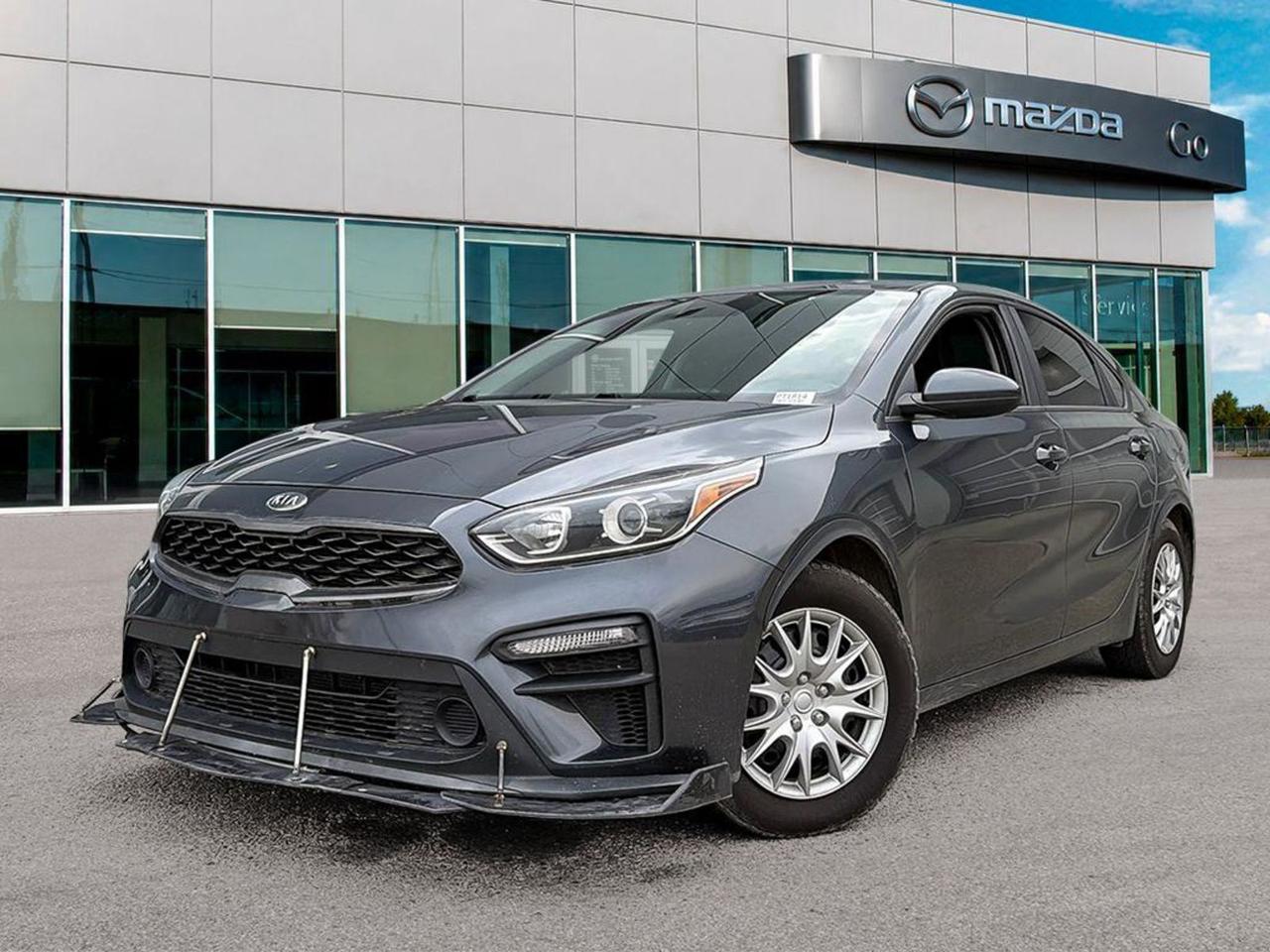 **2020 KiaForte LX  Manual, White & Black Interior** Turn everyday driving into a confident, comfortable experience with this wellkept, preowned 2020 KiaForte LX. Paired with the responsive 6speed manual transmission and a fuelsmart 2.0L MPI 4cylinder engine, this compact sedan delivers a lively ride without sacrificing efficiency.**Why youll love it** - **Sporty control**  6speed manual with overdrive gives you exact revmatch feel; speedsensitive power steering and rackpinion steering keep the front end nimble. - **Allweather comfort**  Heated front bucket seats, heated driver and passengerside mirrors, and dualzone manual climate control keep you cozy in any season. - **Safety you can trust**  6airbag package, ABS with tractioncontrol, electronic stability control, hillstart assist, and tirepressure monitoring give peace of mind on every trip. - **Convenient tech**  8inch touchscreen with Uconnect, Bluetoothenabled handsfree calling, wireless audio streaming, and rearview camera put connectivity and visibility at your fingertips. - **Practical details**  60month/100,000km powertrain warranty, power windows, keyfobless entry, and a spacious 5seat cabin with 60/40 splitfold rear seats make daily life easier.**Key specs at a glance** - **Exterior:** Crisp White with matte black grille and chromeaccented bumpers. - **Wheels:** 15in. steel wheels with fullcover caps, P195/65R15 tires. - **Performance:** Frontwheel drive, 2.0L DOHC engine, 6speed manual. - **Fuelefficient:** LEV3ULEV70 emissions, tier3 Bin70 compliance.Ready to own a reliable, wellequipped sedan that still feels fun to drive? Come testdrive this 2020 Kia Forte LX todayyour next greatvalue vehicle is waiting. Call or stop by the dealership now!