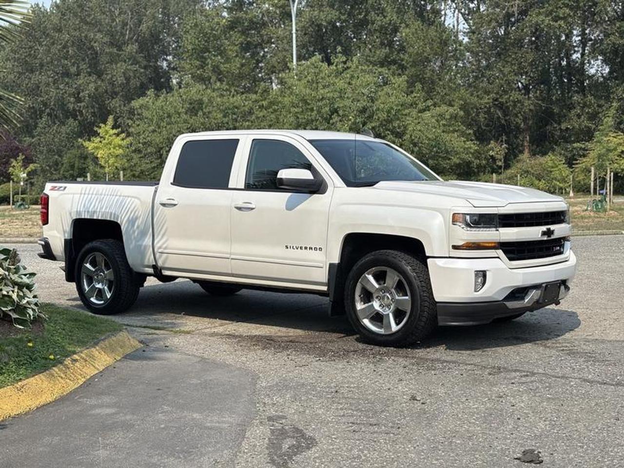 This 2017 Chevrolet Silverado 1500 LT Crew Cab is powered by a 5.3L V8 gasoline engine paired with an automatic transmission and four-wheel drive. Designed for everyday driving, towing, and light-duty hauling, this full-size pickup offers a spacious four-door cab and a range of comfort and convenience features.

The truck is equipped with a trailer hitch receiver, backup camera, rear parking sensors, wireless phone charger, heated front seats, and dual-zone automatic climate control. Additional equipment includes Bluetooth connectivity, automatic headlights, a cargo bed light, cruise control, AM/FM radio, air conditioning and heat, and power windows, power door locks, and power mirrors.

Overall vehicle dimensions are approximately 19 feet 10 inches long, 6 feet 8 inches wide, and 6 feet 2 inches high.

Finished in white with a black cloth interior, this Chevrolet Silverado 1500 LT combines four-wheel-drive capability with practical features and a comfortable cabin suited for work and everyday use. This item is currently OFFSITE. You must register an appointment with our office to schedule an offsite viewing. Appointments must be made a minimum of one business day in advance (and as defined by the days that Repo.com is open for business) before your appointment can be scheduled and confirmed. We may, at our own discretion, instead opt to transport smaller items to Repo.coms main yard for viewing purposes.  $26,580.00 plus $375 processing fee, $26,955.00 total payment obligation before taxes.   Listing report, warranty, contract commitment cancellation fee, financing available on approved credit (some limitations and exceptions may apply). All above specifications and information is considered to be accurate but is not guaranteed and no opinion or advice is given as to whether this item should be purchased. We do not allow test drives due to theft, fraud, acts of vandalism and undetectable impaired driving. Instead we provide the following benefits: Complimentary Warranty (with options to extend), Limited Money Back Satisfaction Guarantee on Fully Completed Contracts, Contract Commitment Cancellation, and an Open-Ended Sell-Back Option. Ask seller for details or call 604-522-REPO(7376) to confirm listing availability.