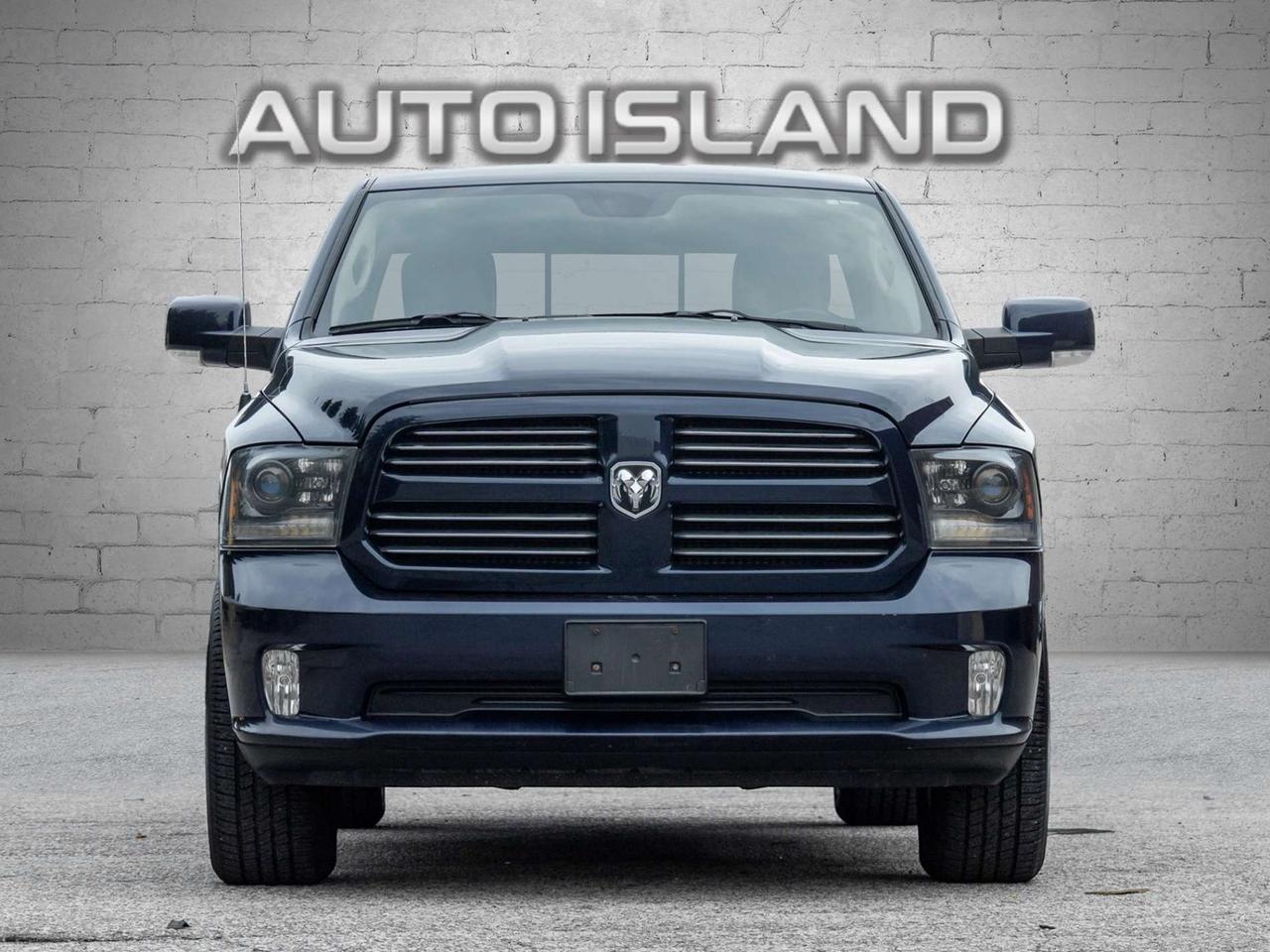 2015 RAM 1500 4WD Quad Cab 140.5 Sport Photo5