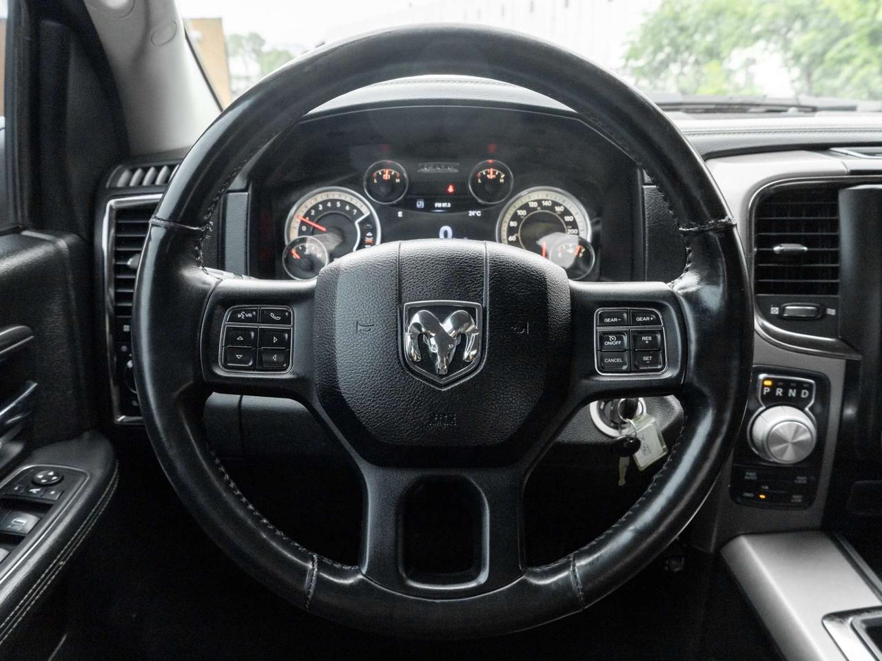 2015 RAM 1500 4WD Quad Cab 140.5 Sport Photo