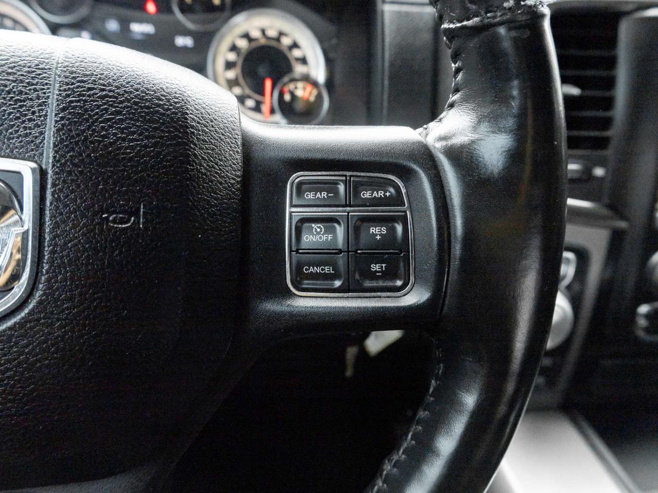 2015 RAM 1500 4WD Quad Cab 140.5 Sport Photo