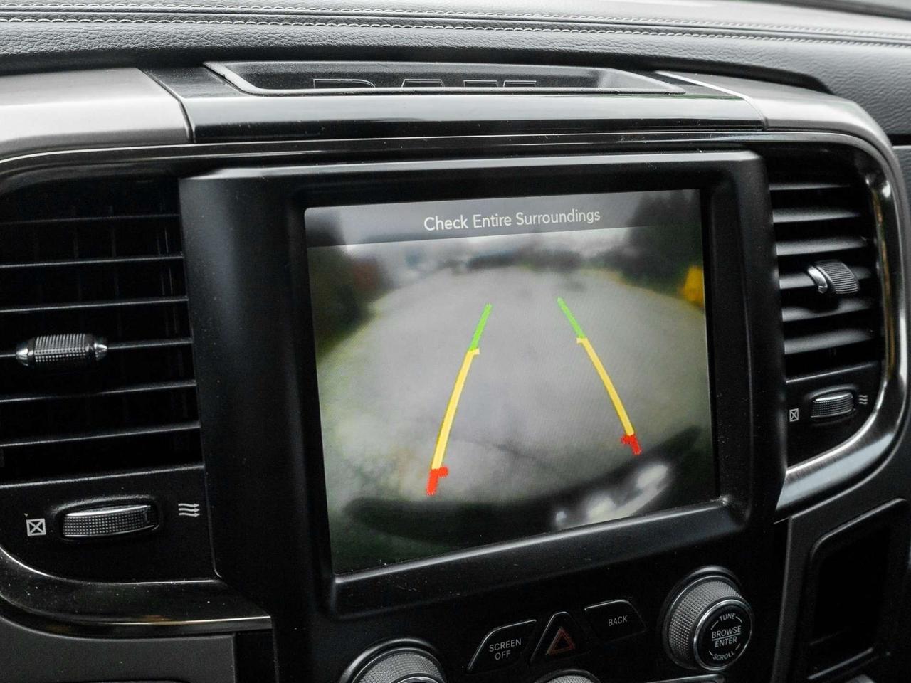 2015 RAM 1500 4WD Quad Cab 140.5 Sport Photo