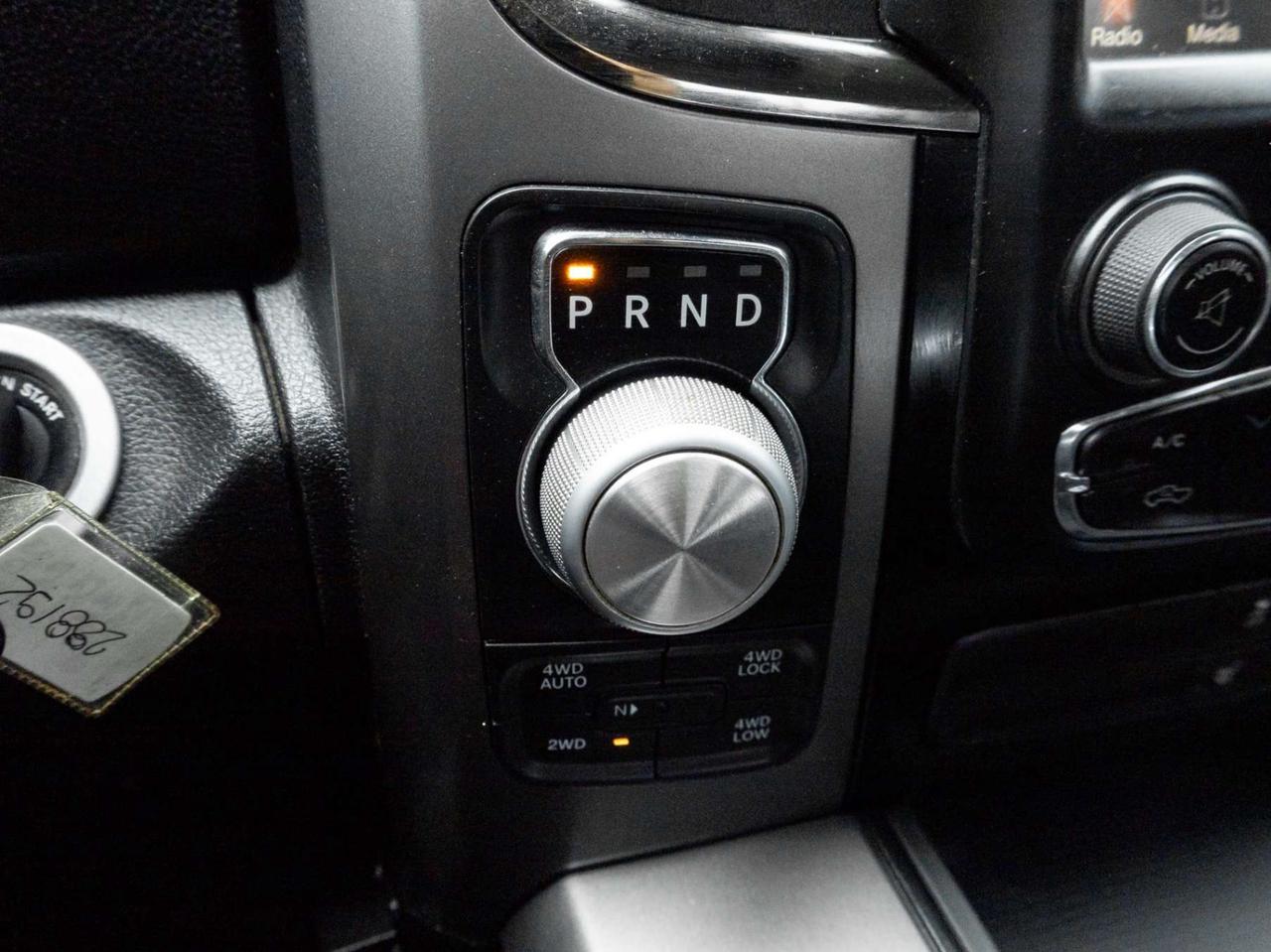2015 RAM 1500 4WD Quad Cab 140.5 Sport Photo