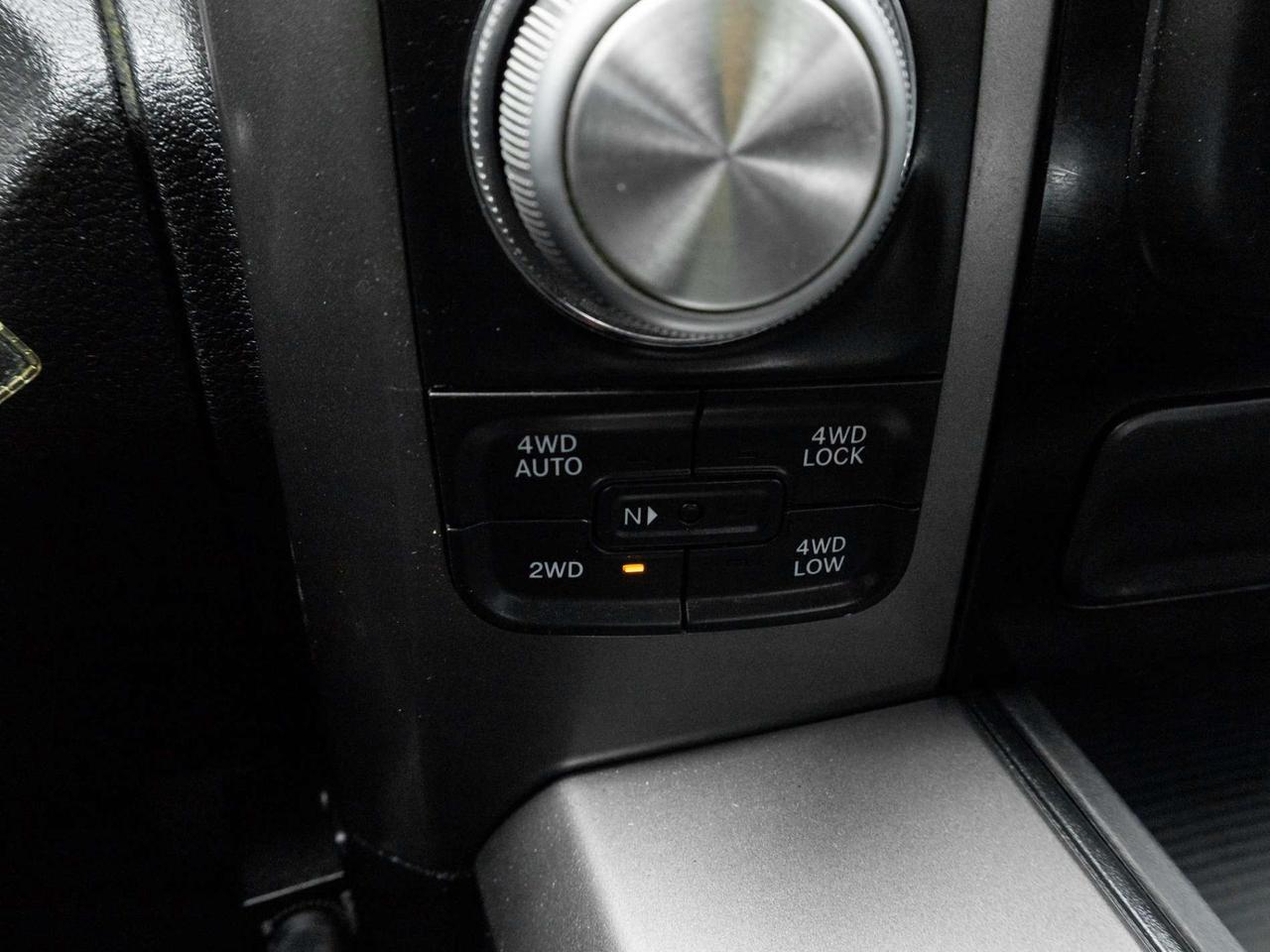 2015 RAM 1500 4WD Quad Cab 140.5 Sport Photo