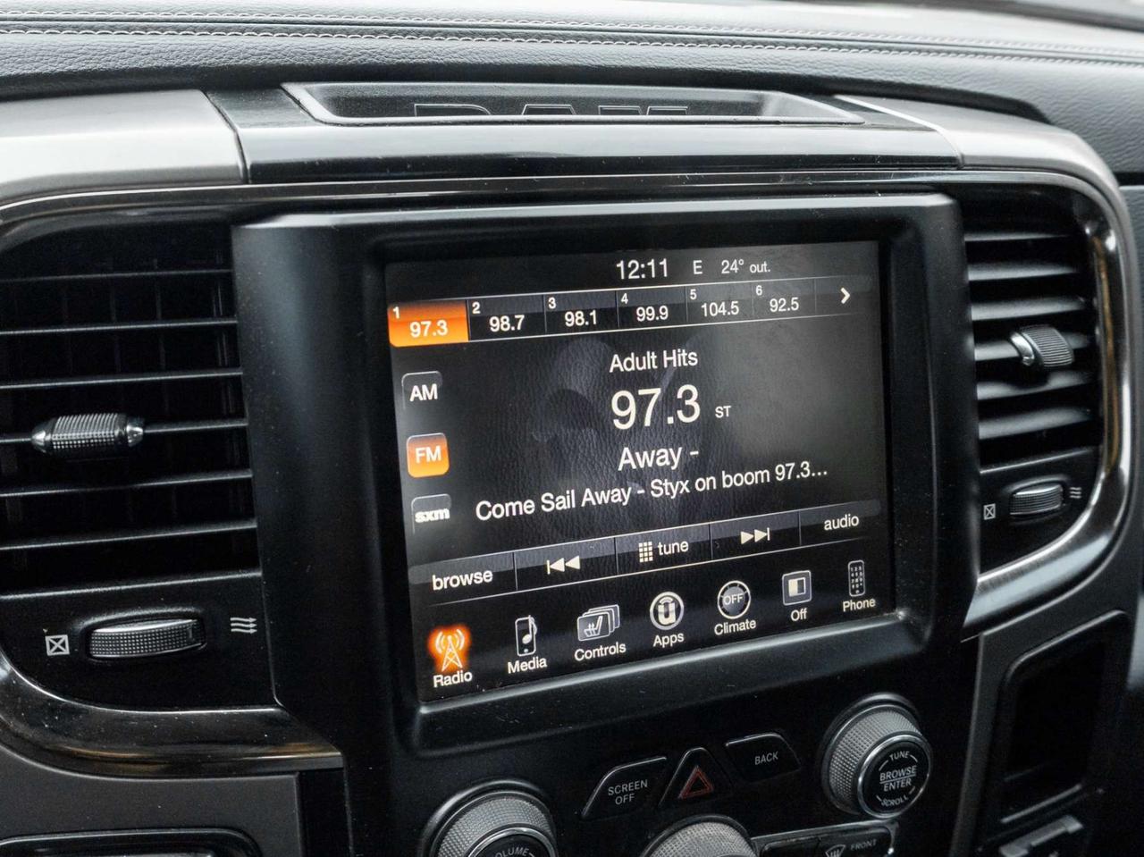 2015 RAM 1500 4WD Quad Cab 140.5 Sport Photo
