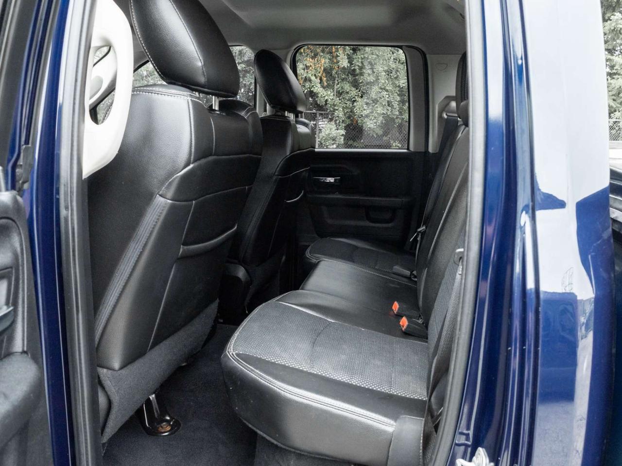2015 RAM 1500 4WD Quad Cab 140.5 Sport Photo