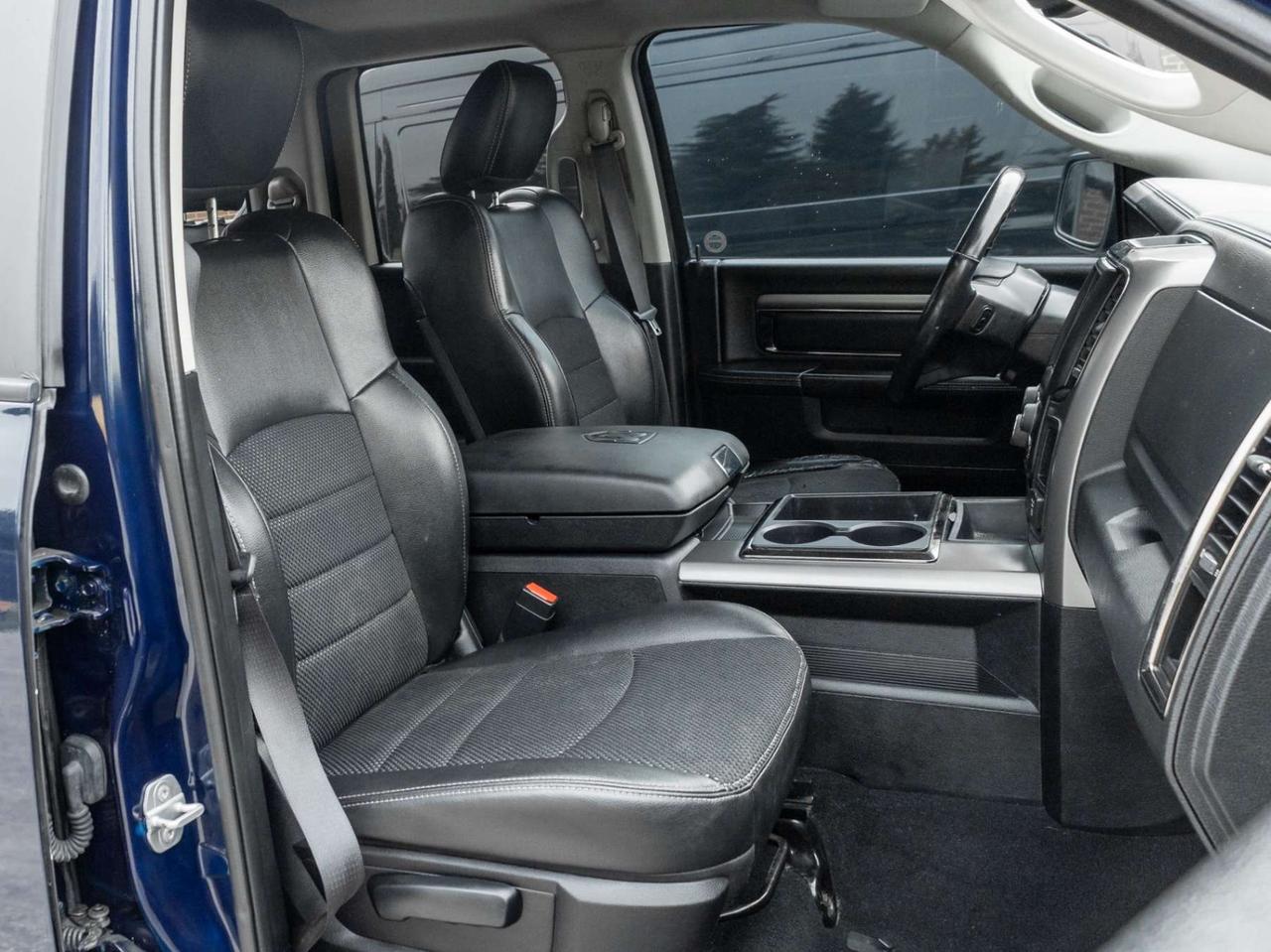 2015 RAM 1500 4WD Quad Cab 140.5 Sport Photo