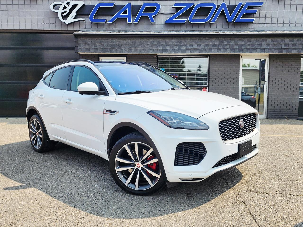 <p>Step into the refined world of the 2019 Jaguar E-Pace R-Dynamic HSE, a luxury compact SUV that masterfully blends sophisticated style with exhilarating performance. This pristine white E-Pace, with its sleek lines and athletic stance, is ready to elevate your everyday driving experience. Inside, the driver-focused cockpit is enveloped in a rich black interior, offering a premium and comfortable sanctuary for every journey. Under the hood, a responsive 2L I4 Turbo engine paired with an automatic all-wheel-drive system ensures confident handling and dynamic power delivery, no matter the road conditions you encounter across Canada.</p><p>This particular E-Pace R-Dynamic HSE, with 133,256 kilometers, has been meticulously maintained and is eager to provide its next owner with years of sophisticated driving pleasure. At Car Zone, we understand the allure of a premium vehicle that doesnt compromise on comfort or capability. This Jaguar E-Pace is more than just an SUV; its a statement of discerning taste and a commitment to an exceptional driving experience.</p><p>Here are five features that truly make this 2019 Jaguar E-Pace R-Dynamic HSE stand out:</p><ul><li><strong>R-Dynamic HSE Trim:</strong> Experience the pinnacle of E-Pace luxury and sportiness, offering a host of exclusive design elements and premium appointments that set it apart.</li><li><strong>All-Wheel Drive System:</strong> Conquer any Canadian road with unwavering confidence, thanks to the intelligent AWD that delivers exceptional traction and stability in all weather conditions.</li><li><strong>2L I4 Turbo Engine:</strong> Unleash responsive power and exhilarating acceleration, making every drive, from city commutes to weekend getaways, an engaging and dynamic affair.</li><li><strong>Premium Black Interior:</strong> Immerse yourself in an environment of sophisticated comfort and refined craftsmanship, where every touchpoint exudes quality and attention to detail.</li><li><strong>Stylish White Exterior:</strong> Turn heads with the crisp, elegant white finish that highlights the E-Paces striking design and sporty silhouette.</li></ul><p>Looking for Your Dream Car? Call Car Zone Today!</p><p>Thanks for viewing our Car Zone inventory. All of our vehicles come fully detailed with a Carfax and a mechanical fitness assessment. Drive this home today! Easy financing options. All credit welcome. APPLY NOW We even take trades. Same day approvals at CARZONECALGARY or visit us in person at 2036 36 Street SE Calgary for a hassle free test drive. Let our friendly team of experts book an appointment with you and show you the Car Zone difference! AMVIC licensed dealer.&nbsp;</p>