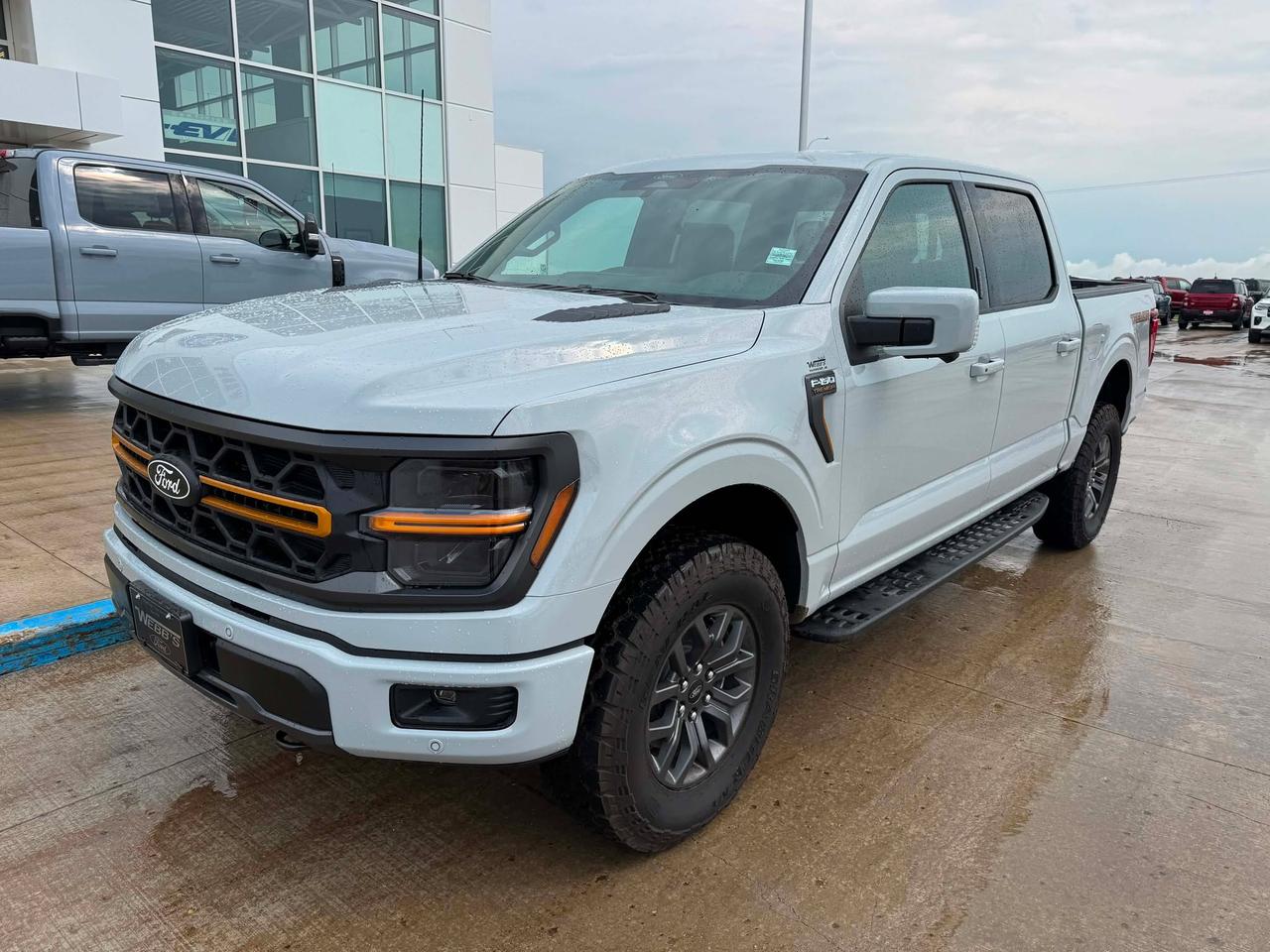 <p>Get ready to conquer any terrain with the brand new 2026 Ford F-150 Tremor 4WD SuperCrew, now available at Webbs 1441! This isnt just a truck; its your ultimate partner for adventure, work, and everything in between. Designed for those who demand capability without compromise, the F-150 Tremor boasts a rugged exterior and a spacious SuperCrew cabin, ensuring comfort and versatility for you and your crew. Whether youre navigating challenging trails or hauling gear for your next project, this F-150 is engineered to perform.</p><p>&nbsp;</p><p>Under the hood, youll find the powerful 3.5L V6 EcoBoost engine, delivering exhilarating performance and impressive towing capabilities. Paired with a smooth 10-speed automatic transmission, every drive is optimized for efficiency and responsiveness. The 4-wheel drive system provides unwavering confidence in all conditions, from icy highways to muddy backroads. At Webbs 1441, we know youre looking for a vehicle that can keep up with your lifestyle, and this 2026 F-150 Tremor is built to exceed those expectations.</p><p>&nbsp;</p><p>Here are five features that truly make this F-150 Tremor stand out:</p><p><br><br></p><ul><li><strong>3.5L V6 EcoBoost Engine:</strong> Unleash a surge of power and torque that makes towing and hauling feel effortless, all while maintaining impressive fuel efficiency.</li></ul><p>&nbsp;</p><ul><li><strong>Electronic 10-Speed Automatic Transmission:</strong> Experience seamless gear changes and optimized performance, ensuring a smooth and responsive ride no matter the situation.</li></ul><p>&nbsp;</p><ul><li><strong>Bed Utility Package:</strong> Transform your truck bed into a functional workspace with integrated features designed to make loading, securing, and accessing your gear easier than ever.</li></ul><p>&nbsp;</p><ul><li><strong>Drivers Side SecuriCode Keyless-Entry Keypad:</strong> Enjoy the convenience and security of keyless entry, allowing you to access your truck with a personalized code, even when your hands are full.</li></ul><p>&nbsp;</p><ul><li><strong>Engine Block Heater:</strong> Say goodbye to cold starts! This essential feature ensures your engine warms up quickly in frigid Canadian temperatures, providing immediate power and protecting vital components.</li></ul><p><br><br></p><p><strong><em>Powered by AutoIntelligence&trade;</em></strong></p><p>&nbsp;</p><p>Powered by AutoIntelligence&trade;</p><p>&nbsp;</p>