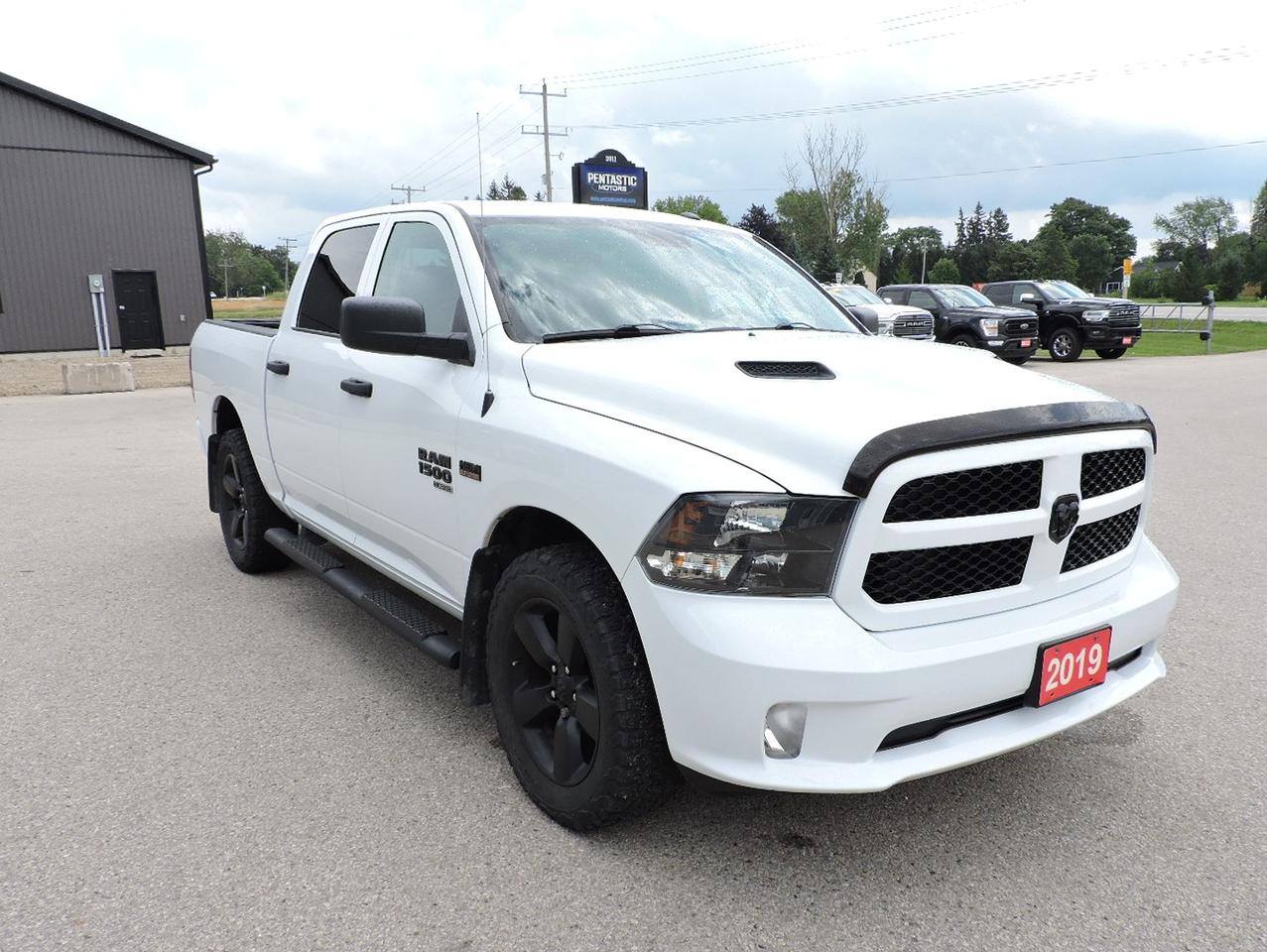 <p>An awesome condition and well maintained, 1-owner 2019 Ram 1500 Express with the Blackout package and Sport hood options. 23 service records on the Carfax report and all done at the Dodge dealership it was purchased at. Powered by a 5.7L Hemi V8 engine, 4-wheel drive, 8-speed automatic transmission and 3:21 gear ratio in the rear ends. Seating for 6 people in this crew cab Ram. Bluetooth, steering wheel mounted audio controls and a back-up camera. Sport hood and black tubular side step options on this Express. A plastic box liner was optioned into the 5-foot 7-inch length box.&nbsp; A must-see single owner 2019 1500.&nbsp;</p><p>** WE UPDATE OUR WEBSITE REGULARLY IF YOU SEE THIS AD THE VEHICLE IS AVAILABLE! ** Pentastic Motors specializes in 4X4 Gasoline and Diesel trucks from all makes including Dodge, Ford, and General Motors. Extended warranties available! &nbsp;Financing available from 7.99% APR OAC. Delivery available to Southern Ontario Purchasers! We are 1.5 hrs from Pearson International Airport and offer free pick up from the airport to Purchasers. Leasing options available for Commercial/Agricultural/Personal! **NO ADMIN FEES! All vehicles are CERTIFIED and serviced unless otherwise stated! CARFAX AVAILABLE ON ALL VEHICLES! ** Call, email, or come in for a test drive today! 1-844-4X4-TRUX www.pentasticmotors.com</p>