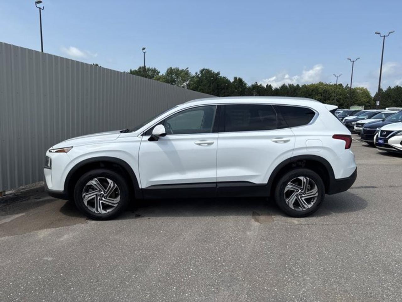 // ACCIDENT FREE!! //<br /><br />This 2021 Hyundai Santa Fe Essential AWD is a smart choice for daily driving in Cayuga and beyond. It is finished in White with a Grey interior, and it offers the confidence of all-wheel drive, an automatic transmission, and a 2.5-litre gas engine. With 82,611 km, this used SUV delivers practical comfort and solid value.<br /><br />Well suited to Canadian roads, this 2021 Hyundai Santa Fe Essential AWD blends easy driving manners with useful features that matter every day. Four doors make access simple for family and friends, while heated front seats and a heated steering wheel help make cold mornings much more pleasant. It is also accident free, adding extra peace of mind.<br /><br />FEATURES OF THE Santa Fe Essential AWD | No Accidents | Heated Steering<br /><br />   Heated steering wheel for cold mornings<br />   All-wheel drive for added road confidence<br />   8-speed automatic transmission shifts smoothly<br />   Apple CarPlay and Android Auto included<br /><br />ADVANCED SAFETY FEATURES<br /><br />   Backup camera helps with tight parking<br />   Lane departure warning adds extra awareness<br />   Adaptive cruise control supports highway driving<br />   Stability control helps maintain secure handling<br /><br />PERFORMANCE AND EFFICIENCY<br /><br />   2.5-litre gas engine delivers smooth power<br />   8-speed automatic supports relaxed driving<br />   All-wheel drive improves year-round traction<br />   Power steering gives easy city control<br /><br />COMFORT AND CONVENIENCE<br /><br />   Heated front seats add winter comfort<br />   Heated steering wheel feels great in winter<br />   Front air conditioning keeps cabin comfortable<br />   Power windows add everyday driving ease<br /><br />TECHNONOLGY AND CONNECTIVITY<br /><br />   Apple CarPlay connects your favourite apps<br />   Android Auto keeps smartphone features handy<br />   Bluetooth integration supports hands-free communication<br />   Steering wheel audio controls feel convenient<br /><br />CARGO SPACE<br /><br />   Rear trunk access makes loading easier<br />   SUV design supports flexible cargo use<br />   Four-door layout helps passenger entry<br />   Rear area suits errands and travel<br /><br />AWARDS & RECOGNITIONS<br /><br />   Top Safety Pick, Insurance Institute for Highway Safety, 2021<br /><br />WHAT OTHER OWNERS LIKE<br /><br />   Comfortable ride quality for daily commuting<br />   User-friendly infotainment with smartphone integration<br />   Confident all-wheel drive in poor weather<br />   Spacious cabin for passengers and gear<br /><br />The 2021 Hyundai Santa Fe Essential AWD stands out with a practical mix of safety, comfort, and modern connectivity. Features like anti-lock braking system, child safety locks, side impact airbags, head side airbags, tire pressure monitoring, and automatic headlights help support a secure and easy drive in many conditions.<br /><br />Inside, this 2021 Hyundai Santa Fe Essential AWD is designed for simple comfort and smart function. The adjustable steering wheel helps you find a natural driving position, while drivers seat lumbar support adds comfort on longer trips. Heated mirrors, electric mirrors, rear window defroster, and tinted windows also help make everyday use more convenient.<br /><br />This SUV also brings useful style and visibility. LED headlamps offer a clear view ahead, and the rear spoiler adds a sporty touch to the profile. Ambient lighting helps create a welcoming cabin feel at night, while illuminated vanity mirrors for both front occupants add a thoughtful everyday detail.<br /><br />For drivers who want a capable used SUV with strong value, this 2021 Hyundai Santa Fe Essential AWD checks the right boxes. It combines accident-free history, automatic convenience, all-wheel drive confidence, and sought-after features like a heated steering wheel, backup camera, Bluetooth, Apple CarPlay, Android Auto, and adaptive cruise control.<br /><br />This 2021 Hyundai Santa Fe Essential AWD | No Accidents | Heated Steerings VIN is: 5NMS2DAJ4MH338797.<br /><br />WHY CHOOSE US? <br /><br />Honest & Transparent Buying Experience: Weve been a trusted name in business since 1984.<br /><br />STRAIGHTFORWARD PRICING:<br />Our Advertised Price Includes:<br />>>Safety Certification (No separate fee!)<br />>>30-Day 100% Mechanical Warranty<br />>>FREE Carfax History Report.<br />>>No upcharge for paying cash.<br />(Prices Exclude HST and Licensing Fees only.)<br /><br />>>Browse 300+ vehicles all in ONE LOCATION<br /><br />EASY FINANCING: Great rates & open loans<br /><br />WE BUY CARS: Get Top Dollar for your trade-in, or sell us your vehicle for CASH! Even if you dont buy from us!<br /><br />STOP BY TODAY<br />Treat yourself - stop by Haldimand Motors Ltd. located at 42 Talbot St E, Cayuga, ON N0A 1E0 to make this car yours today!<br /><br />https://www.haldimandmotors.com/used/stock-461125.html