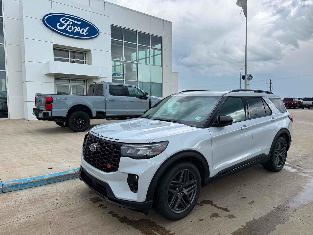<p>Get ready to experience the thrill of the open road like never before with the brand new 2026 Ford Explorer ST 4WD, now available at Webbs 1441. This isnt just an SUV; its a statement of power, performance, and sophisticated style, designed for those who demand more from their drive. From its striking Space White Metallic exterior to the meticulously crafted Onyx interior, every detail of this Explorer ST has been engineered to impress. Whether youre navigating city streets or venturing off the beaten path, the robust 4-wheel drive system ensures confidence and capability in any condition.</p><p>&nbsp;</p><p>Under the hood, the heart of this beast is the potent 3.0L EcoBoost V6 engine, paired with a seamless 10-speed automatic transmission. This dynamic duo delivers exhilarating acceleration and responsive handling, making every journey an adventure. Inside, youll find a cabin that blends sporty luxury with everyday practicality. The unique Miko suede sport captains chairs in the front and second rows offer exceptional comfort and support, while the versatile 2nd-row bench with E-Z entry and armrest provides flexible seating for passengers. Plus, with features like all-weather floor liners and an engine block heater, this Explorer ST is ready for whatever Canadian weather throws your way.</p><p>&nbsp;</p><p>Here are five features that truly set this 2026 Ford Explorer ST 4WD apart:</p><p><br><br></p><ul><li><strong>3.0L EcoBoost V6 Engine:</strong> Unleash exhilarating power and responsive performance with this potent V6, designed for thrilling acceleration and a dynamic driving experience.</li></ul><p>&nbsp;</p><ul><li><strong>Heat/Vent Unique Miko Suede Sport Captains Chairs:</strong> Indulge in unparalleled comfort and sporty style with these premium seats that offer both heating and ventilation for year-round driving pleasure.</li></ul><p>&nbsp;</p><ul><li><strong>4-Wheel Drive System:</strong> Conquer any terrain with confidence, knowing this Explorer ST is equipped to handle diverse road conditions and challenging adventures with superior traction and control.</li></ul><p>&nbsp;</p><ul><li><strong>10-Speed Automatic Transmission:</strong> Experience smooth, efficient, and incredibly responsive gear changes that optimize both performance and fuel economy.</li></ul><p>&nbsp;</p><ul><li><strong>SecuriCode Keyless Entry Keypad:</strong> Enjoy the convenience and security of keyless entry, allowing you to access your vehicle with a personalized code, perfect for busy lifestyles.</li></ul><p><br><br></p><p><strong><em>Powered by AutoIntelligence&trade;</em></strong></p><p>&nbsp;</p><p>Powered by AutoIntelligence&trade;</p><p>&nbsp;</p>
