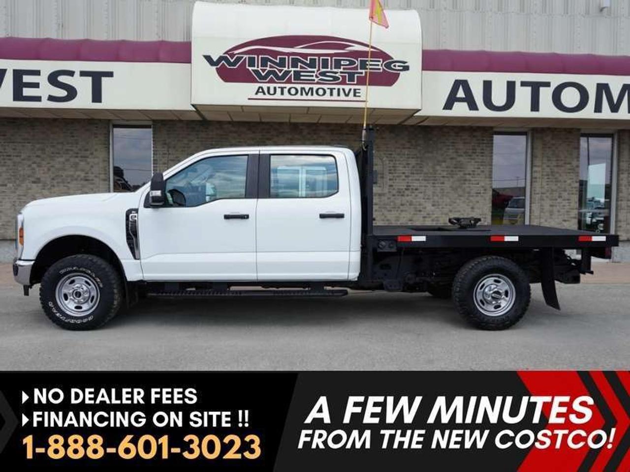 *** Dealer arranged financing on site! Quick, Simple,  no calls or waiting on bank appointments required!! Drive away today ***   NO ADMINISTRATION FEES!!

2024 Ford Super Duty F-350 XL  * * * FLAT DECK TRUCK WITH HIDDEN / Fifth-wheel trailer hitch * * * 10-Speed Automatic - - 7.3L "Godzilla" V8 gas engine - - Telescoping trailer tow mirrors - - Full-length running boards - - FORD SYNC Infotainment system - - Bluetooth - - Apple CarPlay and Android Auto - - Valet Mode  - -   REMOTE START  - -  Rear backup camera - - Integrated Trailer Brake Controller - - Electronic-Locking Rear Differential.

Oxford white exterior. Black Commercial Grille with black bumper faceplate. Well-maintained interior. 
Spacious Crew Cab configuration.  Husky heavy duty floor liners. 

Excellent history. Lots of added VALUE!!!!! Fords 7.3L "Godzilla" V8 gas engine.  The Hidden DSP Falcon series fifth-wheel trailer hitch low-profile model is especially optimized for flat decks, stock trailers, or commercial towing setups.  With hands free steering wheel controls, full length running boards.  This is ready for whatever you want to haul, tow, load on this truck.   

Features

- 4WD
- 7.3L "Godzilla" V8 
- 430 horsepower and 475 lb-ft of torque
- Flat deck w/ side steps
- Headache rack
- DSP Falcon fifth-wheel trailer hitch
- Manual telescoping trailer tow mirrors 
- Ford SYNC Infotainment system
- Bluetooth connectivity
- Apple CarPlay and Android Auto
- Rear backup camera
- Hands-free calling
- Integrated Trailer Brake Controller
- 60/40 split-fold rear bench seats
- Goodyear Wrangler all-terrain tires
- Black Commercial Grille
- Power windows
- Power doors 
- Power / heated mirrors
- Manual tilt and telescoping steering wheel column
- Integrated Controls on steering wheel
- Upfitter switch panel
- Interior power outlets
- Drive mode selector
- Electronic-Locking Rear Differential

Comes with a Manitoba Safety Certification, and we have many Extended Powertrain warranties available on your vehicle purchase up to 10-year coverage (on eligible vehicles see dealer for details). Financing on site with Zero down financing OAC. Trades accepted. View at Winnipeg West Automotive Group, 5195 Portage Ave. (only a couple of minutes past the new Costco) Dealer permit # 6007.  This Car is located in Winnipeg Manitoba,  however we can have it shipped anywhere in North America relatively inexpensively.