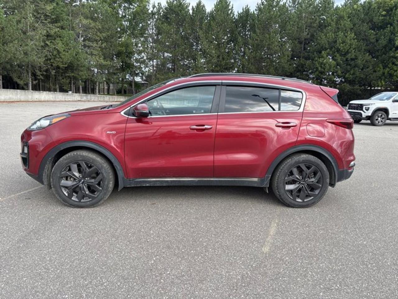 // ACCIDENT FREE!! // <br />// SINGLE OWNER! //<br /><br />Finished in red with a black interior, this 2021 Kia Sportage EX S AWD is a smart compact SUV with the confidence of all-wheel drive and the comfort drivers want every day. It has 81,000 km, a 2.4-litre gas engine, four doors, and a smooth 6-speed automatic transmission.<br /><br />This used 2021 Kia Sportage EX S AWD offers a great mix of value, utility, and modern features for commuting, family use, and weekend travel. Its clean history, single-owner background, and practical feature set make it an easy SUV to enjoy in every season around Cayuga and beyond.<br /><br />FEATURES OF THE Sportage EX S AWD | One Owner | No Accidents | Heated Steering<br /><br />   Panoramic sunroof adds open-air cabin feel <br />   Heated steering wheel for cold mornings <br />   Blind spot monitor adds driving confidence <br />   Apple CarPlay and Android Auto included <br /><br />ADVANCED SAFETY FEATURES<br /><br />   Backup camera helps with reversing visibility <br />   Lane departure warning supports safer travel <br />   Blind spot monitor aids lane changes <br />   Anti-lock brakes and stability control included <br /><br />PERFORMANCE AND EFFICIENCY<br /><br />   2.4-litre gas engine balances everyday performance <br />   All-wheel drive adds year-round traction <br />   6-speed automatic delivers smooth shifting response <br />   Dual shift mode adds control <br /><br />COMFORT AND CONVENIENCE<br /><br />   Heated front seats add winter comfort <br />   Heated steering wheel feels great in winter <br />   Power driver seat includes lumbar support <br />   Push button start adds daily ease <br /><br />TECHNONOLGY AND CONNECTIVITY<br /><br />   Apple CarPlay connects your favourite apps <br />   Android Auto keeps smartphone access simple <br />   Bluetooth integration supports hands-free communication <br />   Steering wheel audio controls improve convenience <br /><br />CARGO SPACE<br /><br />   Rear trunk access makes loading easier <br />   Four-door layout helps passengers enter easily <br />   Compact SUV shape suits daily cargo <br />   Rear area handles errands and gear <br /><br />AWARDS & RECOGNITIONS<br /><br />   Top Safety Pick, Insurance Institute for Highway Safety, 2021 <br /><br />WHAT OTHER OWNERS LIKE<br /><br />   Comfortable ride quality for daily driving <br />   User-friendly infotainment and phone integration <br />   Useful cargo room for active lifestyles <br />   Confident all-wheel-drive traction in poor weather <br /><br />The 2021 Kia Sportage EX S AWD stands out with a clean, athletic design that still feels practical and easy to live with. The red exterior brings energy to its look, while details like fog lights, tinted windows, a rear spoiler, and heated mirrors add everyday function and style.<br /><br />Inside, this 2021 Kia Sportage EX S AWD keeps things comfortable and simple. The black cabin is well laid out, with front air conditioning, power windows, power steering, an adjustable steering wheel, illuminated vanity mirrors, and ambient lighting that helps create a refined feel on the road.<br /><br />Convenience is a strong point in this 2021 Kia Sportage EX S AWD. Retractable electric mirrors, automatic headlights, automatic door locks, and a rear window defroster all help make daily driving easier. The trailer hitch also adds extra usefulness for drivers who need more versatility from their SUV.<br /><br />This 2021 Kia Sportage EX S AWD also delivers reassuring safety with driver and passenger airbags, side impact airbags, head side airbags, child safety locks, tire pressure monitoring, and a passenger airbag sensor. These core features help support confidence whether you are in town, on the highway, or out in changing weather.<br /><br />For drivers shopping at Haldimand Motors Ltd. in Cayuga, this SUV offers the right balance of comfort, traction, technology, and proven value. With its accident-free history, one-owner status, heated steering wheel, panoramic sunroof, and smartphone connectivity, it is ready for many more kilometres ahead.<br /><br />This 2021 Kia Sportage EX S AWD | One Owner | No Accidents | Heated Steerings VIN is: KNDPNCAC1M7935924.<br /><br />WHY CHOOSE US? <br /><br />Honest & Transparent Buying Experience: Weve been a trusted name in business since 1984.<br /><br />STRAIGHTFORWARD PRICING:<br />Our Advertised Price Includes:<br />>>Safety Certification (No separate fee!)<br />>>30-Day 100% Mechanical Warranty<br />>>FREE Carfax History Report.<br />>>No upcharge for paying cash.<br />(Prices Exclude HST and Licensing Fees only.)<br /><br />>>Browse 300+ vehicles all in ONE LOCATION<br /><br />EASY FINANCING: Great rates & open loans<br /><br />WE BUY CARS: Get Top Dollar for your trade-in, or sell us your vehicle for CASH! Even if you dont buy from us!<br /><br />STOP BY TODAY<br />Treat yourself - stop by Haldimand Motors Ltd. located at 42 Talbot St E, Cayuga, ON N0A 1E0 to make this car yours today!<br /><br />https://www.haldimandmotors.com/used/stock-461036.html