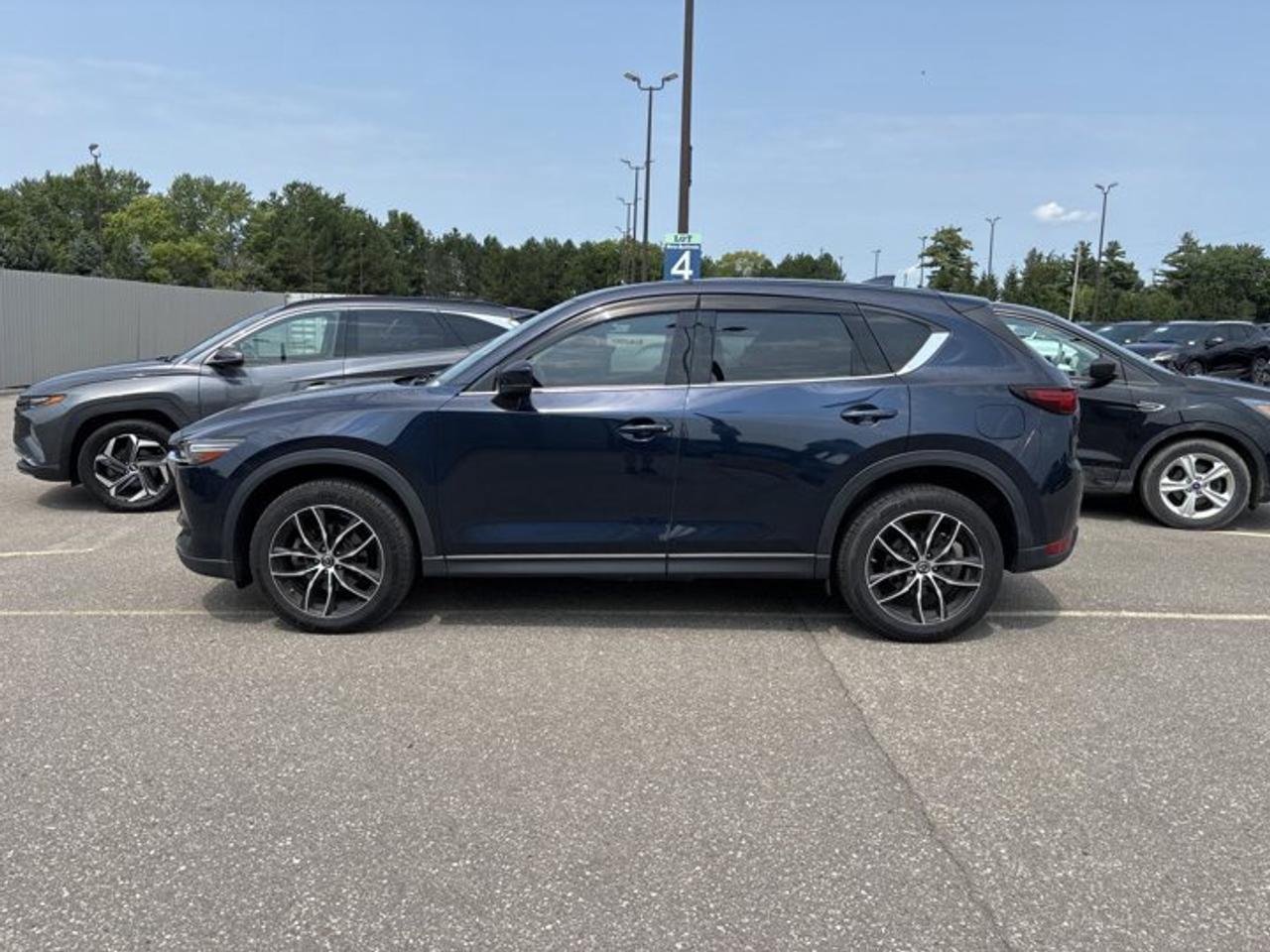 // ACCIDENT FREE!! //<br /><br />This 2019 Mazda CX-5 GT w/Turbo AWD is a smart choice for drivers who want power, comfort, and year-round confidence. Sold by Haldimand Motors Ltd. in Cayuga, this used SUV blends a lively 2.5-litre gas engine with automatic transmission and all-wheel drive for smooth, sure travel.<br /><br />Finished in Blue with a Black interior, this 4-door Mazda CX-5 GT w/Turbo AWD has a refined look and a premium feel. With 132,228 km on the odometer, it offers a strong mix of proven durability, upscale features, and practical family-ready versatility for daily driving and weekend trips.<br /><br />FEATURES OF THE CX-5 GT w/Turbo AWD | No Accidents | Ventilated Seats | Sunroof | Heated Steering Wheel<br /><br />   Turbo power with confident all-wheel drive<br />   Ventilated front seats for added comfort<br />   Power sunroof brings in light<br />   Heated steering wheel for cold mornings<br /><br />ADVANCED SAFETY FEATURES<br /><br />   Backup camera helps with tight parking<br />   Blind spot monitor adds lane awareness<br />   Lane departure warning supports safer travel<br />   Adaptive cruise control eases highway driving<br /><br />PERFORMANCE AND EFFICIENCY<br /><br />   2.5-litre turbocharged gas engine delivers strong response<br />   Automatic transmission shifts smoothly in traffic<br />   All-wheel drive boosts all-season confidence<br />   Stability control helps maintain secure handling<br /><br />The 2019 Mazda CX-5 GT w/Turbo AWD is well known for balanced road manners. Its turbocharged 2.5-litre engine gives strong passing power, while the 6-speed automatic transmission keeps the drive smooth and easy. Power steering and dual shift mode add a more engaging feel behind the wheel.<br /><br />COMFORT AND CONVENIENCE<br /><br />   Ventilated front seats help in summer<br />   Heated front and rear seats included<br />   Dual-zone climate control adds comfort<br />   Power liftgate makes loading more convenient<br /><br />Inside, the 2019 Mazda CX-5 GT w/Turbo AWD offers an inviting cabin with thoughtful details for daily comfort. Memory seating, a power drivers seat with lumbar support, a power passenger seat, heated steering wheel, and push button start all help make every trip easier and more relaxing.<br /><br />TECHNONOLGY AND CONNECTIVITY<br /><br />   Apple CarPlay keeps apps close<br />   Android Auto adds easy phone access<br />   Bluetooth integration supports hands-free calling<br />   Navigation system helps guide each trip<br /><br />This 2019 Mazda CX-5 GT w/Turbo AWD also brings useful tech to every drive. A head-up display helps keep key information in view, while HD Radio, satellite radio, and steering wheel audio controls make it simple to stay informed and entertained on the road.<br /><br />CARGO SPACE<br /><br />   Rear trunk access is wide and useful<br />   Power liftgate helps with busy days<br />   Four doors support easy passenger entry<br />   Flexible SUV layout suits daily hauling<br /><br />The 2019 Mazda CX-5 GT w/Turbo AWD gives you the versatility expected from a compact SUV. Groceries, sports gear, and travel bags fit with ease, while the rear area is designed to make loading simple. It is a practical fit for commuting, errands, and family use.<br /><br />AWARDS & RECOGNITIONS<br /><br />   Top Safety Pick, Insurance Institute for Highway Safety, 2019<br />   Best Compact Utility Vehicle, Automobile Journalists Association of Canada, 2018<br /><br />WHAT OTHER OWNERS LIKE<br /><br />   Strong turbo power feels quick and smooth<br />   Quiet cabin adds comfort on trips<br />   Premium interior design feels upscale<br />   Confident all-wheel drive in poor weather<br /><br />Drivers often praise the 2019 Mazda CX-5 GT w/Turbo AWD for its upscale feel, strong turbo performance, and composed ride. Many also enjoy its easy-to-use technology, supportive seating, and the extra confidence that comes from all-wheel drive during Ontario winters and wet road conditions.<br /><br />This 2019 Mazda CX-5 GT w/Turbo AWD | No Accidents | Ventilated Seats | Sunroof | Heated Steering Wheels VIN is: JM3KFBDYXK0513592.<br /><br />WHY CHOOSE US? <br /><br />Honest & Transparent Buying Experience: Weve been a trusted name in business since 1984.<br /><br />STRAIGHTFORWARD PRICING:<br />Our Advertised Price Includes:<br />>>Safety Certification (No separate fee!)<br />>>30-Day 100% Mechanical Warranty<br />>>FREE Carfax History Report.<br />>>No upcharge for paying cash.<br />(Prices Exclude HST and Licensing Fees only.)<br /><br />>>Browse 300+ vehicles all in ONE LOCATION<br /><br />EASY FINANCING: Great rates & open loans<br /><br />WE BUY CARS: Get Top Dollar for your trade-in, or sell us your vehicle for CASH! Even if you dont buy from us!<br /><br />STOP BY TODAY<br />Treat yourself - stop by Haldimand Motors Ltd. located at 42 Talbot St E, Cayuga, ON N0A 1E0 to make this car yours today!<br /><br />https://www.haldimandmotors.com/used/stock-461128.html