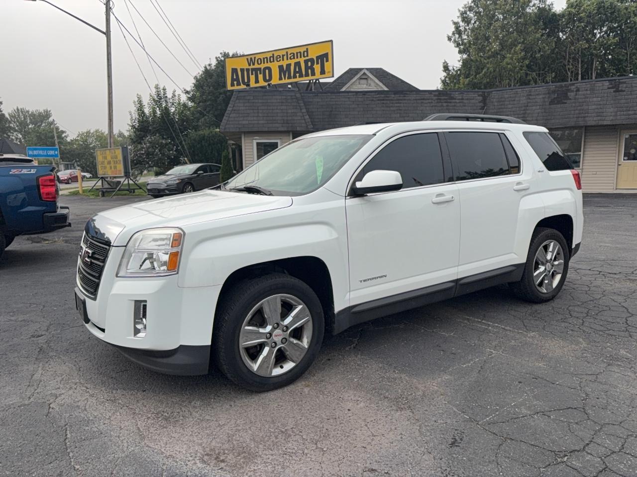 <p>Discover exceptional value and style at Wonderland Auto Mart with this stunning used 2014 GMC Terrain SLT. This white beauty, with its sleek SUV/Crossover design and comfortable black interior, offers a fantastic driving experience for any adventure. With only one owner and a spotless Carfax report, you can drive with confidence knowing this vehicle has been meticulously cared for. Perfect for navigating city streets or venturing out on the open road, this front-wheel-drive Terrain is ready for its next chapter.</p><p>This 2014 GMC Terrain SLT has been driven for 136,985 kilometers, a testament to its reliable performance. Its automatic transmission ensures a smooth and effortless ride, while the gasoline engine provides efficient power for your daily commute and weekend getaways. Whether youre looking for a practical family vehicle or a versatile personal transport, this GMC Terrain delivers on both fronts, offering ample space and comfort for all your needs.</p><p>Here are five of the most exciting features of this 2014 GMC Terrain SLT:</p><ul><li><strong>One Owner - Clean Carfax:</strong> Enjoy peace of mind with a history of single ownership and a pristine Carfax report, assuring you of its excellent condition and transparent past.</li><li><strong>Luxurious Leather Interior:</strong> Sink into the comfort and sophistication of supple black leather seating, adding a touch of premium elegance to every drive.</li><li><strong>Versatile SUV/Crossover Body Style:</strong> Enjoy the perfect blend of car-like handling and SUV utility, making it ideal for both urban exploration and weekend escapes.</li><li><strong>Smooth Automatic Transmission:</strong> Experience effortless driving with the seamless shifting of the automatic transmission, designed for optimal performance and fuel efficiency.</li><li><strong>Sleek White Exterior:</strong> Turn heads with the classic and sophisticated white exterior, presenting a clean and timeless aesthetic that always looks sharp.</li></ul><p><strong><em>Powered by AutoIntelligence&trade;</em></strong></p><p>Vehicle information has been generated using artificial intelligence and is provided for informational purposes only. While efforts are made to ensure accuracy, please confirm all details directly with the dealer.</p>