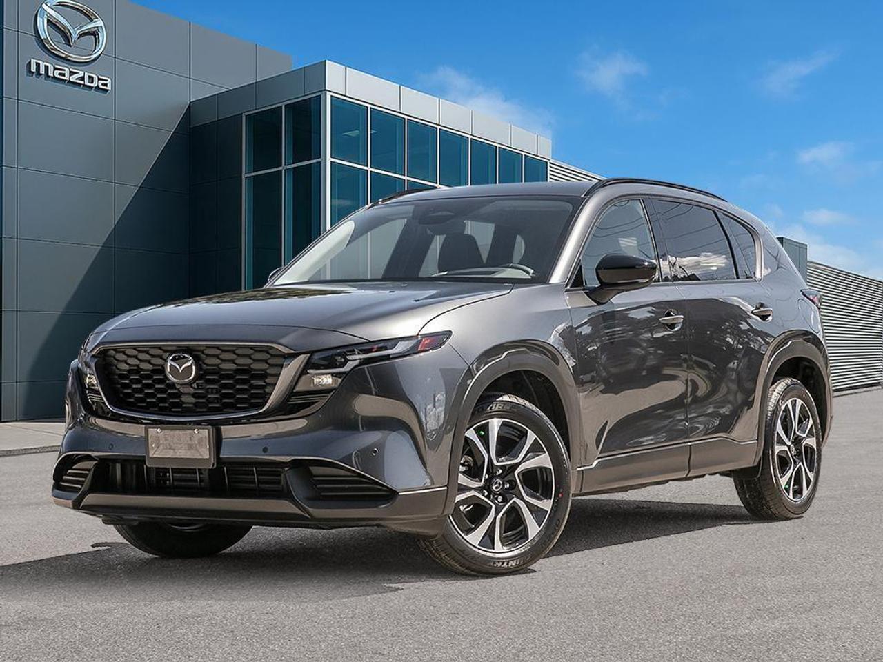 <p>Meet the 2026 Mazda CX-5 GS in a sophisticated gray finish with all-wheel-drive capability, designed to provide confident handling on any terrain. This dynamic SUV combines practicality with style, perfect for those seeking both adventure and elegance on the road.</p><p>The exterior stands out with its Machine Grey Metallic paint, while the interior offers comfort with black leatherette and cloth upholstery. The vehicle's stylish design is complemented by the inclusion of alloy wheels, ensuring you're turning heads wherever you go.</p><p>Inside the cabin, technology and convenience come together with features like a navigation system, heads up display, and Bluetooth connection. Stay safe and aware with advanced safety options including lane assist, backup camera, and parking sensors. The CX-5 is also equipped with adaptive cruise control, ensuring a relaxed driving experience even on long journeys.</p><p>Ideal for families and tech-savvy drivers who prioritize comfort and safety, the 2026 Mazda CX-5 GS AWD offers everything you need for a confident ride. Don't miss the chance to experience it for yourselfcontact Cobourg Mazda today for more information and to schedule your test drive.</p>