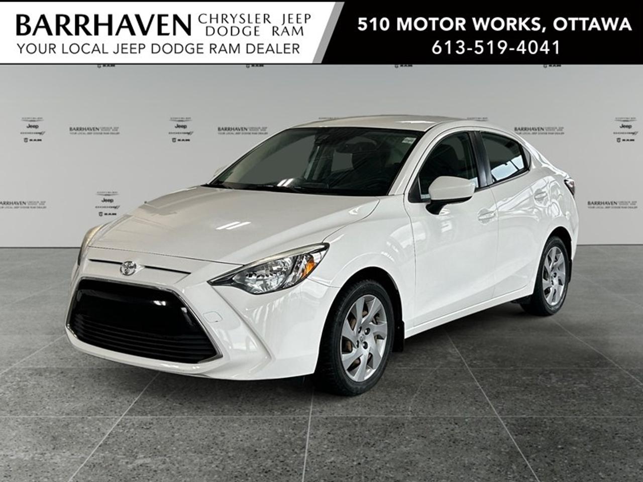 Experience the perfect blend of style and efficiency with the 2017 Toyota Yaris 5-Speed in striking white. This front-wheel-drive sedan offers nimble handling and an engaging ride, especially with its smooth manual transmission. The Yaris is designed to make an impression; its exterior boasts a clean, modern look. Slide into the thoughtfully crafted interior where comfort meets functionality. With ultra low kilometres, this vehicle feels as fresh as its features, including air conditioning to keep you cool and power windows for convenience. Stay connected on the go with the Bluetooth connection, ensuring your journey is as seamless as it is enjoyable. Designed with your safety in mind, this Yaris is equipped with brake assist and cruise control for a confident drive. Plus, the keyless entry adds an extra layer of convenience to your daily routine. This Toyota Yaris is perfect for city dwellers or first-time buyers looking for a reliable, efficient vehicle. Contact Barrhaven Jeep Dodge Chrysler Ram today to learn more about this outstanding sedan and schedule a test drive. Dont miss out on this opportunity to own a thoroughly reliable car with ultra low kilometres! FREE CARFAX, NO ADMIN FEES, NON SMOKER, CERTIFIED PRICE PLUS TAX ONLY!!