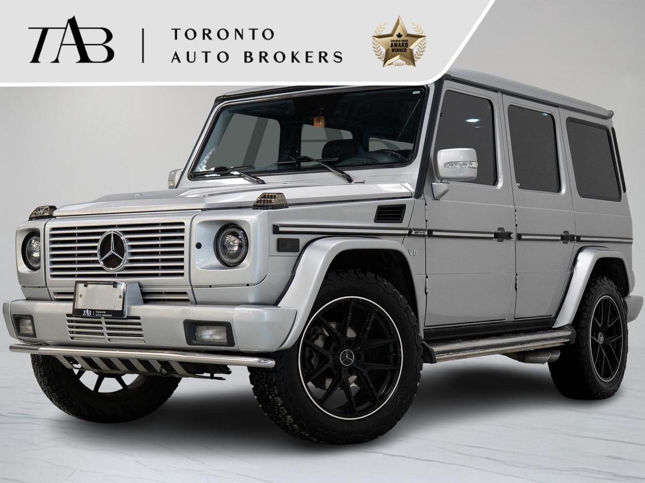 This 2004 Mercedes-Benz G-Class 55 is a local Ontario vehicle with a clean Carfax report. Finished with the Designo Package and equipped with modern upgrades like Apple CarPlay, this iconic G-Class combines rugged off-road capability with luxury features and timeless Mercedes-Benz styling.

Top Key Features:

1. Designo Package
2. Sunroof
3. Apple CarPlay Integration
4. Leather Interior
5. Heated Front Seats
6. Heated Steering Wheel
7. Power Adjustable Front Seats with Memory
8. Dual-Zone Automatic Climate Control
9. Premium Audio System
10. Navigation System
11. Rearview Camera with Parking Assist
12. Blind Spot Monitoring & Driver Assistance Features
13. Keyless Entry & Push-Button Start
14. 20-Inch Alloy Wheels
15. LED Headlights
16. Rugged All-Terrain Tires
17. Signature G-Class Exterior Styling
18. Solid Axle Suspension
19. Four-Wheel Drive with Low-Range Capability
20. Tow Hooks & Off-Road Protection
21. Iconic Boxy Exterior Design


NOW OFFERING 3 MONTH DEFERRED FINANCING PAYMENTS ON APPROVED CREDIT.

 WE OFFER THE BEST FINANCE RATES, AND DONT CHARGE ANY FINANCING FEE 

Looking for a top-rated pre-owned luxury car dealership in the GTA? Look no further than Toronto Auto Brokers (TAB)! Were proud to have won multiple awards, including the 2024 AutoTrader Best Priced Dealer, the 2024 CarGurus Award, the 2025 Top Choice Award, the 2025 Consumer Satisfaction Award, the 2025 Canadian Choice Award, the 2025 Three Best Rated Dealer Award, and many more!

With 30 years of experience serving the Greater Toronto Area, TAB is a respected and trusted name in the pre-owned luxury car industry. Our 30,000 sq.Ft indoor showroom is home to a wide range of luxury vehicles from top brands like BMW, Mercedes-Benz, Audi, Porsche, Land Rover, Jaguar, Aston Martin, Bentley, Maserati, and more. And we dont just serve the GTA, were proud to offer our services to all cities in Canada, including Vancouver, Montreal, Calgary, Edmonton, Winnipeg, Saskatchewan, Halifax, and more.

At TAB, were committed to providing a no-pressure environment and honest work ethics. As a family-owned and operated business, we treat every customer like family and ensure that every interaction is a positive one. Come experience the TAB Lifestyle at its truest form, luxury car buying has never been more enjoyable and exciting!

We offer a variety of services to make your purchase experience as easy and stress-free as possible. From competitive and simple financing and leasing options to extended warranties, aftermarket services, and full history reports on every vehicle, we have everything you need to make an informed decision. We welcome every trade, even if youre just looking to sell your car without buying, and when it comes to financing or leasing, we offer same day approvals, with access to over 50 lenders, including all of the banks in Canada. Feel free to check out your own Equifax credit score without affecting your credit score, simply click on the Equifax tab above and see if you qualify.

So if youre looking for a luxury pre-owned car dealership in Toronto, look no further than TAB! We proudly serve the GTA, including Toronto, Etobicoke, Woodbridge, North York, York Region, Vaughan, Thornhill, Richmond Hill, Mississauga, Scarborough, Markham, Oshawa, Peteborough, Hamilton, Newmarket, Orangeville, Aurora, Brantford, Barrie, Kitchener, Niagara Falls, Oakville, Cambridge, Kitchener, Waterloo, Guelph, London, Windsor, Orillia, Pickering, Ajax, Whitby, Durham, Cobourg, Belleville, Kingston, Ottawa, Montreal, Vancouver, Winnipeg, Calgary, Edmonton, Regina, Halifax, and more.

Call us today or visit our website to learn more about our inventory and services. And remember, all prices exclude applicable taxes and licensing, and vehicles can be certified at an additional cost of $999.