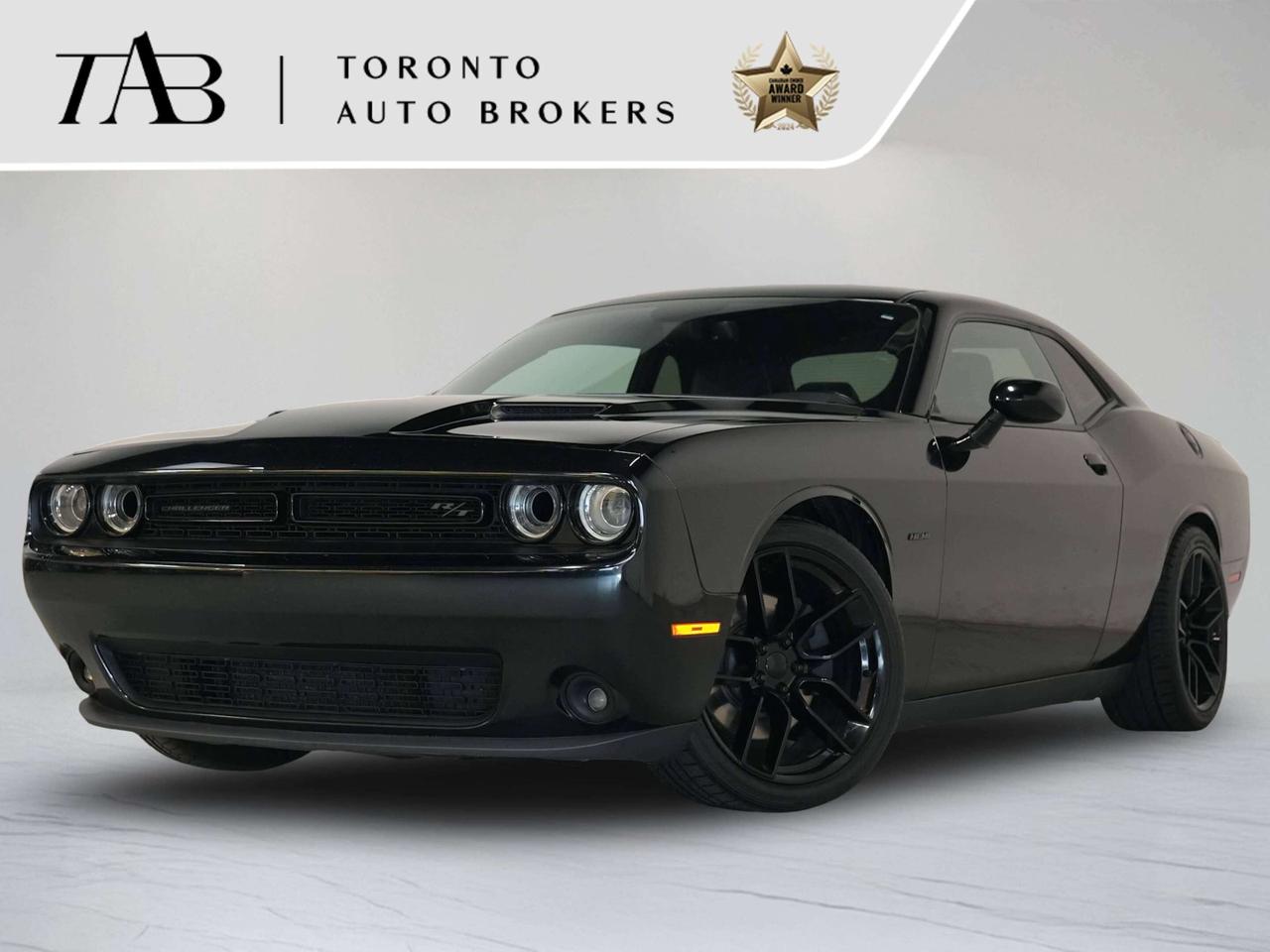 This aggressive 2016 Dodge Challenger R/T is a Canadian vehicle, combining classic muscle-car styling with impressive V8 performance and a comfortable, well-equipped interior. Powered by a legendary 5.7L HEMI V8 engine and paired with an automatic transmission, the Challenger R/T delivers the unmistakable sound and performance of an American muscle car while offering plenty of everyday drivability.

Standard & Featured Options Include:

5.7L HEMI V8 Engine
8-Speed Automatic Transmission
Rear-Wheel Drive
20" Alloy Wheels
Alpine Premium Audio System
Uconnect Infotainment System
Touchscreen Display
Bluetooth Connectivity
Apple CarPlay & Android Auto
Navigation System
Premium Sport Seats
Heated Front Seats
Heated Steering Wheel
Dual-Zone Automatic Climate Control

NOW OFFERING 3 MONTH DEFERRED FINANCING PAYMENTS ON APPROVED CREDIT. 

WE OFFER THE BEST FINANCE RATES, AND DONT CHARGE ANY FINANCING FEE 

Looking for a top-rated pre-owned luxury car dealership in the GTA? Look no further than Toronto Auto Brokers (TAB)! Were proud to have won multiple awards, including the 2024 AutoTrader Best Priced Dealer, the 2024 CarGurus Award, the 2025 Top Choice Award, the 2025 Consumer Satisfaction Award, the 2025 Canadian Choice Award, the 2025 Three Best Rated Dealer Award, and many more!

With 30 years of experience serving the Greater Toronto Area, TAB is a respected and trusted name in the pre-owned luxury car industry. Our 30,000 sq.Ft indoor showroom is home to a wide range of luxury vehicles from top brands like BMW, Mercedes-Benz, Audi, Porsche, Land Rover, Jaguar, Aston Martin, Bentley, Maserati, and more. And we dont just serve the GTA, were proud to offer our services to all cities in Canada, including Vancouver, Montreal, Calgary, Edmonton, Winnipeg, Saskatchewan, Halifax, and more.

At TAB, were committed to providing a no-pressure environment and honest work ethics. As a family-owned and operated business, we treat every customer like family and ensure that every interaction is a positive one. Come experience the TAB Lifestyle at its truest form, luxury car buying has never been more enjoyable and exciting!

We offer a variety of services to make your purchase experience as easy and stress-free as possible. From competitive and simple financing and leasing options to extended warranties, aftermarket services, and full history reports on every vehicle, we have everything you need to make an informed decision. We welcome every trade, even if youre just looking to sell your car without buying, and when it comes to financing or leasing, we offer same day approvals, with access to over 50 lenders, including all of the banks in Canada. Feel free to check out your own Equifax credit score without affecting your credit score, simply click on the Equifax tab above and see if you qualify.

Call us today or visit our website to learn more about our inventory and services. And remember, all prices exclude applicable taxes and licensing, and vehicles can be certified at an additional cost of $999.