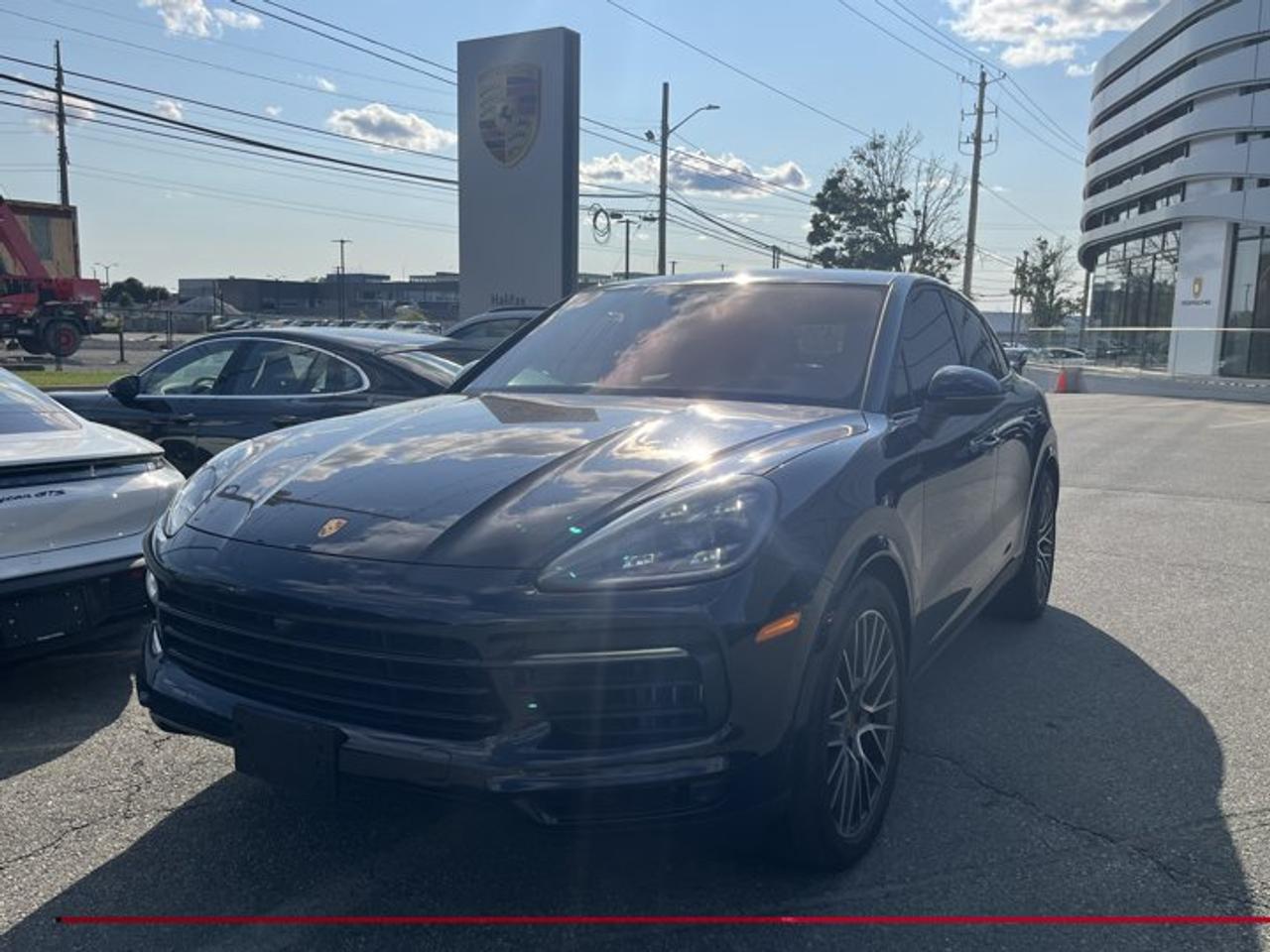 This 2021 Porsche Cayenne S Coupé, now available at Porsche Of Halifax, is finished in Moonlight Blue Metallic with a Leather Interior in Graphite Blue/Chalk and is equipped with a PDK transmission.This Cayenne comes with a Certified Pre-Owned Designation, which includes a 2 Year Porsche Approved Warranty with Unlimited Kilometer restriction! Full 2 Years from the date of purchase!*Powertrain and Drivetrain*2.9-litre twin-turbocharged V6 engine producing 434 horsepower and 405 lb-ft of torquePDK transmissionPorsche Active All-Wheel Drive*Exterior*Moonlight Blue Metallic21 RS Spyder Design Wheels incl. Wheel Arch Extensions in Exterior ColorAll-season tires for 21-inch alloy wheelsLED-Matrix Design Headlights in Black incl. Porsche Dynamic Light System Plus (PDLS+)Sport Exhaust System incl. Tailpipes in BlackTrailer Hitch without Tow BallHeated Windshield*Interior and Seating*Leather Interior in Graphite Blue/ChalkAdaptive Sport Seats Plus (18-way) with Memory PackageHeated Seats (Front and Rear)Ventilated Seats (Front)4-Zone Climate ControlRear Comfort Seats (2+1)Steering Column Casing in LeatherPorsche Crest on Headrests (Front and Rear)Ambient LightingStorage compartment including inductive charging station*Technology and Driver Assistance*BOSE® Surround Sound SystemHead-Up DisplaySurround ViewLane Change Assist (LCA)Comfort AccessAuto-Dimming MirrorsAdaptive Air Suspension incl. Porsche Active Suspension Management (PASM)Rear Axle SteeringThis Cayenne S Coupé is configured with a twin-turbocharged powertrain, advanced chassis technologies, and a high level of comfort, technology, and driver assistance features.Visit www.porscheofhalifax.com or call (902)453-8800 to speak with a Porsche Sales Executive.