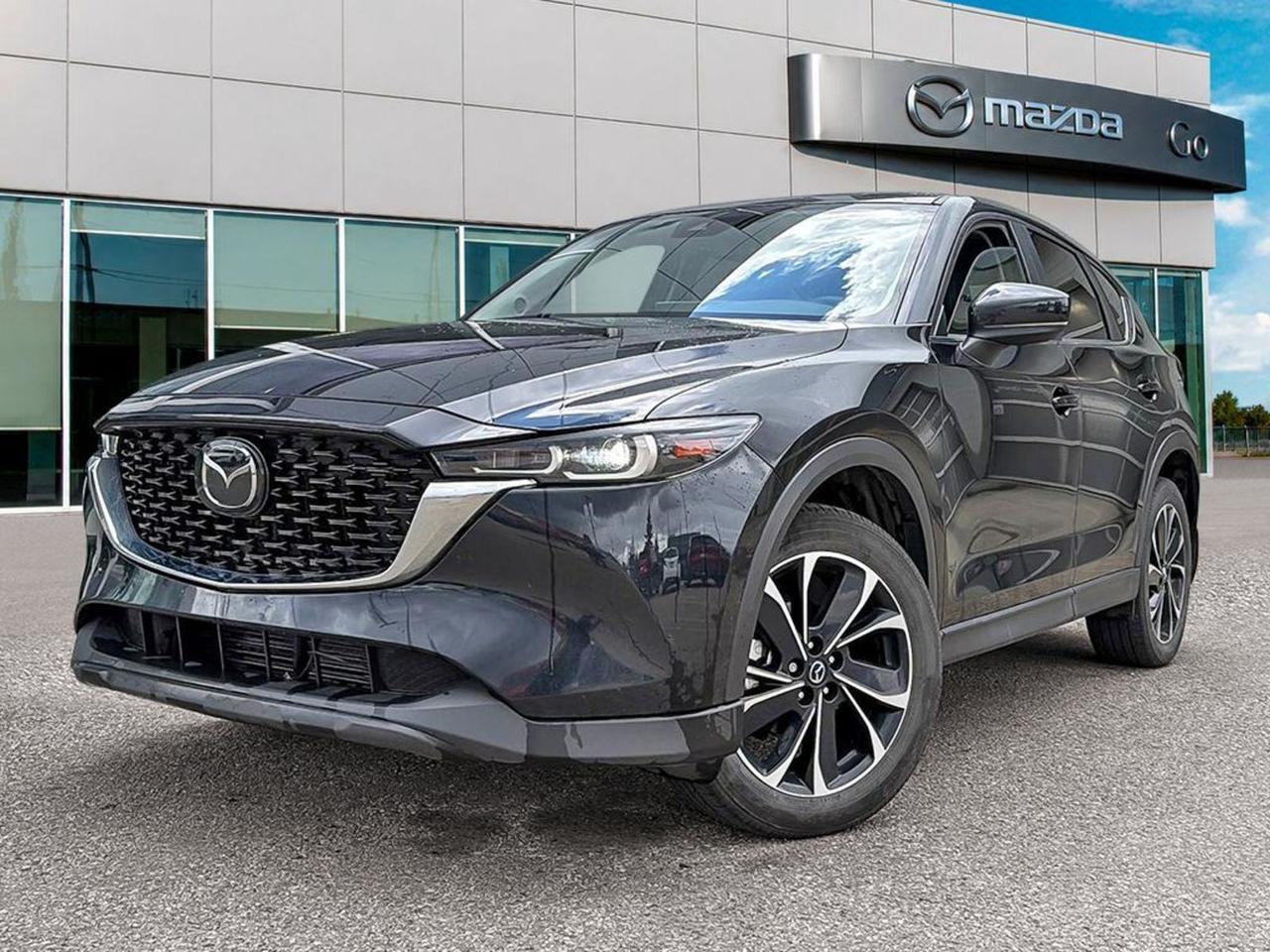 **2025 MazdaCX5  Black on Black (PreOwned)** Experience the perfect blend of style, agility, and confidence in this sleek, allblack 2025 MazdaCX5. With its sophisticated black exterior and matching black interior, this compact SUV turns heads wherever it goes. - **Dynamic performance:** SKYACTIVG engine delivers strong acceleration with excellent fuelefficiency, while Mazdas renowned handling makes every drive feel sporty and composed. - **Premium comfort:** Quiet cabin, supportive seats and a driverfocused layout keep you and your passengers comfortable on city streets or weekend getaways. - **iACTIVSENSE safety:** Standard advanced driverassist featuresincluding Adaptive Cruise Control, LaneKeep Assist, BlindSpot Monitoring, and Automatic Emergency Brakinggive you peace of mind on every journey. - **Connected technology:** MazdaConnect infotainment with a crisp touchscreen, AppleCarPlay/AndroidAuto integration, and a premium sound system keep you connected and entertained. This preowned CX5 has been thoroughly inspected, comes with a clean vehicle history, and is ready for its next adventure. **Drive it todayschedule your test drive and see why the CX5 is the SUV that truly fits your lifestyle.**