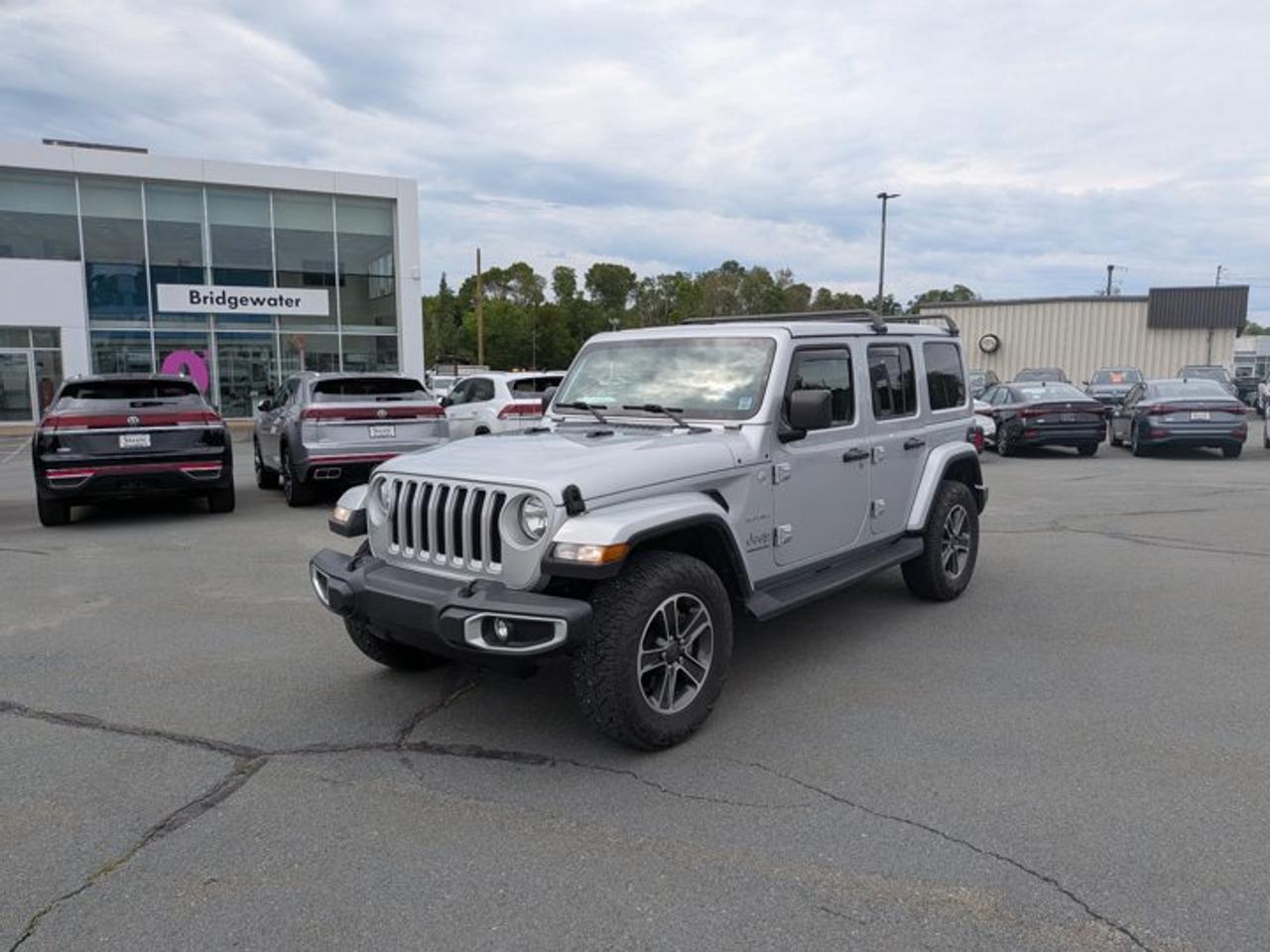 Recent Arrival! 2023 Jeep Wrangler Sahara4x4 | Apple CarPlay | Android Auto Certified.This vehicle is a Steele Certified Pre-Owned Vehicle, offering added confidence through enhanced inspection standards and dealership-backed benefits. Steele Certified Reconditioning Process: Comprehensive multi-point inspection Mechanical and cosmetic reconditioning completed as needed Brake, tire, and battery assessment Professional detailing Final quality control road test Steele Certified Pre-Owned vehicles include additional ownership benefits. Any concerns related to the certification process must be reviewed and addressed by the original selling dealer.Silver Zynith Clearcoat 4WD 8-Speed Automatic 2.0L I4 DOHC 3.45 Rear Axle Ratio, 4-Wheel Disc Brakes, 9 Speakers, ABS brakes, Air Conditioning, Alloy wheels, AM/FM radio: SiriusXM, Apple CarPlay/Android Auto, Auto-dimming Rear-View mirror, Automatic temperature control, Auxiliary Battery, Black Freedom Top 3-Piece Hardtop, Body-Colour 3-Piece Hardtop, Brake assist, Cloth Bucket Seats w/Sahara Logo, Cold Weather Group, Compass, Convertible HardTop, Dana M220 Rear Axle, Delay-off headlights, Driver door bin, Driver vanity mirror, Dual front impact airbags, Dual front side impact airbags, Electronic Stability Control, Emergency communication system: SiriusXM Guardian, Freedom Panel Storage Bag, Front anti-roll bar, Front Bucket Seats, Front dual zone A/C, Front fog lights, Front Heated Seats, Front reading lights, Fully automatic headlights, Garage door transmitter, Glass rear window, Heated door mirrors, Heated Steering Wheel, Illuminated entry, Integrated roll-over protection, Low tire pressure warning, Navigation System, Non-Locking Fuel-Filler Cap, Occupant sensing airbag, Outside temperature display, Panic alarm, ParkView Rear Back-Up Camera, Passenger door bin, Passenger vanity mirror, Power door mirrors, Power steering, Power windows, Quick Order Package 22G Sahara, Radio data system, Radio: Uconnect 4C Nav w/8.4 Display, Rear anti-roll bar, Rear reading lights, Rear Window Defroster, Rear window defroster, Rear window wiper, Rear Window Wiper w/Washer, Remote keyless entry, Remote Start System, Security system, Selec-Speed Control, Side Steps w/Diamond-Plate Pattern, Speed control, Split folding rear seat, Steering wheel mounted audio controls, Stop/Start Dual Battery System, Tachometer, Telescoping steering wheel, Tilt steering wheel, Trac-Lok Limited-Slip Rear Differential, Traction control, Trip computer, Variably intermittent wipers, Voltmeter, Wheels: 18 x 7.5 Machined w/Grey Spokes.