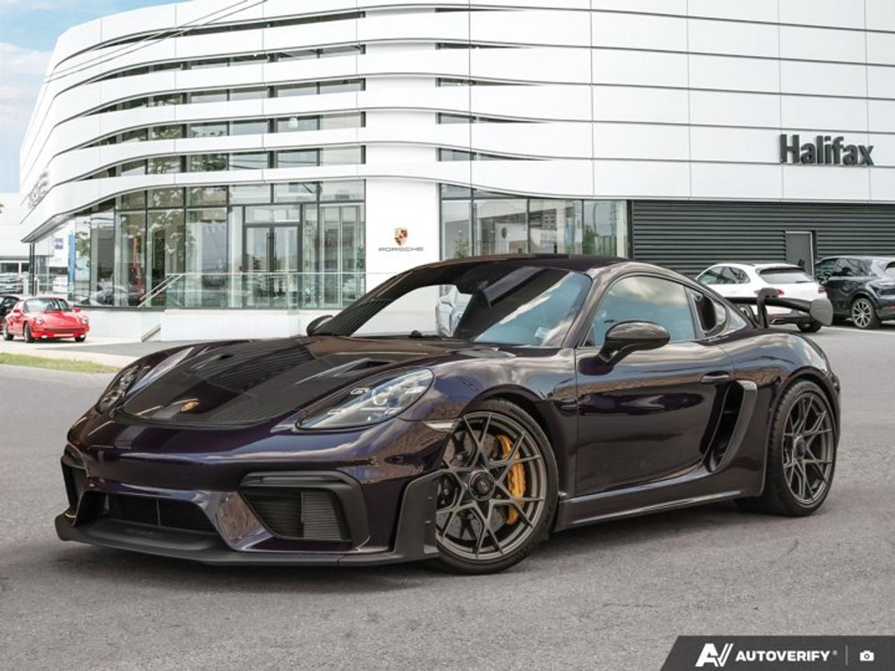 This 2025 Porsche 718 Cayman GT4 RS, now available at Porsche Of Halifax, is finished in Paint to Sample Viola Metallic with a Leather/Race-Tex Interior in Black with Arctic Grey Stitching and Weissach Package and is equipped with a PDK transmission.Certified PreOwned. Unlimited Kilometer Warranty until April, 2031. Extended the warranty time period available. Ask us for details.*Powertrain and Drivetrain*4.0-litre naturally aspirated flat-6 engine producing 493 horsepower and 331 lb-ft of torquePDK transmissionRear-wheel drive*Exterior*Paint to Sample Viola MetallicWeissach PackageFront Trunk Lid and Wing in Exposed Carbon Fiber/Partially PaintedWindow Triangle Trims in Carbon FiberLED Headlights incl. Porsche Dynamic Light System (PDLS)Front Axle Lift SystemPorsche Ceramic Composite Brakes (PCCB)Personalized Vehicle Keys Painted incl. One Key Pouch in Leather*Interior and Seating*Leather/Race-Tex Interior in Black with Arctic Grey StitchingAdaptive Sport Seats Plus (18-way)Heated SeatsSteering Wheel and Gear Lever/Selector in Black LeatherExtended Deviated Stitching Interior PackageSteering Column Casing in Leather with Deviated StitchingSeat Belts in Racing YellowDoor Pull Loops in Racing YellowDoor-Sill Guards in Carbon Fiber, IlluminatedSun Visors in Race-Tex*Technology and Driver Assistance*BOSE® Surround Sound SystemChrono PackageAuto-Dimming Mirrors with Integrated Rain SensorLight Design PackagePreparation for Porsche Dashcam (Front)Smoking PackageLuggage Net in Passenger Footwell*Exclusive Manufaktur Details*Dashboard with Deviated Stitching in Racing YellowUpper Door Panel with Deviated Stitching in Racing YellowDoor Center Panel with Deviated Stitching in Racing YellowDoor Armrest with Deviated Stitching in Racing YellowDoor Grab Handle with Deviated Stitching in Racing YellowCenter Console with Deviated Stitching in Racing YellowCenter Console Lid with Deviated Stitching in Racing YellowSteering Wheel Rim with Deviated Stitching in Racing YellowSeats with Deviated Stitching in Racing YellowGear Lever Boot with Deviated Stitching in Racing YellowThis 718 Cayman GT4 RS is configured with a naturally aspirated motorsport-derived powertrain, extensive Weissach Package content, and a high level of Porsche Exclusive Manufaktur customization.Visit www.porscheofhalifax.com or call (902)453-8800 to speak with a Porsche Sales Executive.