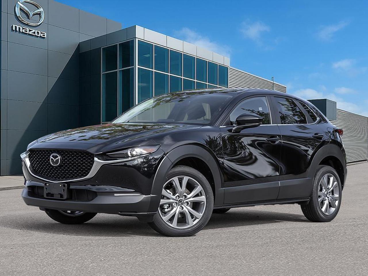 <p>The stunning 2026 Mazda CX-30 GS in an elegant Black exterior with a robust AWD drivetrain promises remarkable handling and performance. This new SUV is designed to captivate with its Jet Black Mica finish elegantly contrasting the Black Cloth Upholstery in the interior, ensuring you travel in style and comfort.</p> <p>Step inside to experience an inviting interior equipped with heated front seats and a heated steering wheel, perfect for Canadian winters. The CX-30 boasts a leather steering wheel and leatherette door trim for a touch of luxury. Its modern design includes metal-look instrument panel inserts, creating an aesthetic that is both sophisticated and functional.</p> <p>Tech-savvy drivers will enjoy the backup camera, smart device integration, and Bluetooth connectivity, all of which keep you connected and safe on the road. Safety is paramount with features like lane assist and adaptive cruise control, offering peace of mind every time you get behind the wheel.</p> <p>If you're a tech enthusiast or a family looking for a dependable vehicle packed with advanced safety features and comfort, the Mazda CX-30 GS is for you. Contact Cobourg Mazda today to explore the endless possibilities this SUV offers and elevate your driving experience.</p>