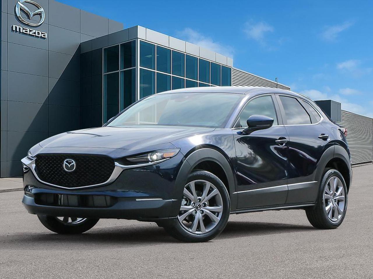 <p>The 2026 Mazda CX-30 GS AWD is a perfect blend of performance and versatility in a stunning blue finish with an advanced all-wheel-drive system for superior handling on any road. Its exterior exudes confidence with the Deep Crystal Blue Mica paint and sleek alloy wheels, while the black cloth upholstery inside offers a refined touch combined with practical functionality.</p> <p>Experience comfort and style with features like heated seats, a sophisticated leather steering wheel, and leatherette door trim inserts, complemented by a metal-look instrument panel design. The CX-30 GS AWD ensures a pleasurable drive with smart device integration, keeping you connected without the hassle.</p> <p>Safety and technology go hand in hand with essential elements like a backup camera, lane assist, adaptive cruise control, and brake assist, all designed to enhance your peace of mind on the road. Additionally, you can benefit from the convenience of keyless entry and a heated steering wheel for those chilly days.</p> <p>The 2026 Mazda CX-30 GS AWD is ideal for tech-savvy individuals or families seeking a reliable and stylish SUV. Visit Cobourg Mazda today to experience it first-hand and find out more about this exceptional vehicle.</p>