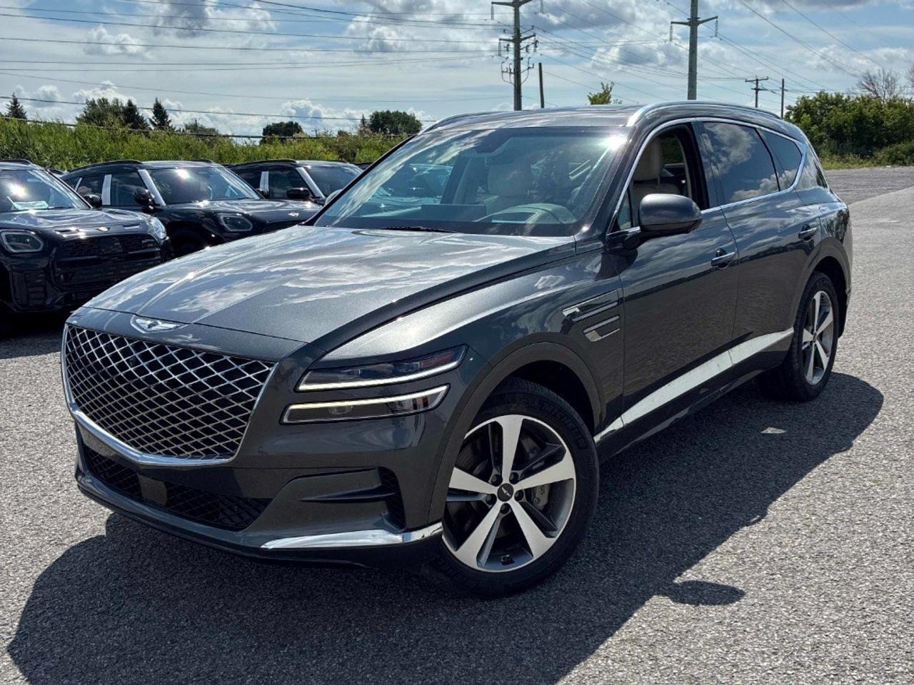 Balance of 5 year/100,000kms BASIC warranty and 10 year/160,000kms Factory Powertrain Warranty on ALL MITSUBISHI products! Best in the industry!!!! Experience the excellence of the 2023 Genesis GV80 2.5T Advanced, now available in a refined gray color with all-wheel drive for unparalleled control. Its automatic transmission promises smooth handling, whether navigating urban streets or venturing off the beaten path. The GV80 is designed with a stunning exterior that turns heads wherever you go. Step inside to enjoy a luxurious interior, embellished with exquisite leather seats and leatherette door trim inserts that define comfort and sophistication. Host to an array of features such as alloy wheels, a panoramic sunroof/moonroof, and power seats, this SUV harmonizes style with practicality. Equipped with top-tier technology, the GV80 ensures every journey is safer and more enjoyable. Stay connected through smart device integration and relax to your favorite tunes via satellite radio. The navigation system complements your drive, while the heads-up display keeps essential information front and center. Safety is prioritized with features like a backup camera, parking sensors, lane assist, and brake assist, giving you confidence on every drive. Perfect for families or the modern professional, this vehicle includes comforts such as heated and cooled front seats, a heated rear seat, as well as a leather steering wheel and heated steering wheel to combat those cold Canadian mornings. With adaptive cruise control and keyless entry enhancing convenience, the GV80 2.5T Advanced is tailored for those who appreciate luxury and innovation. Contact Bank Street Mitsubishi now to schedule a test drive and step into the future of driving.