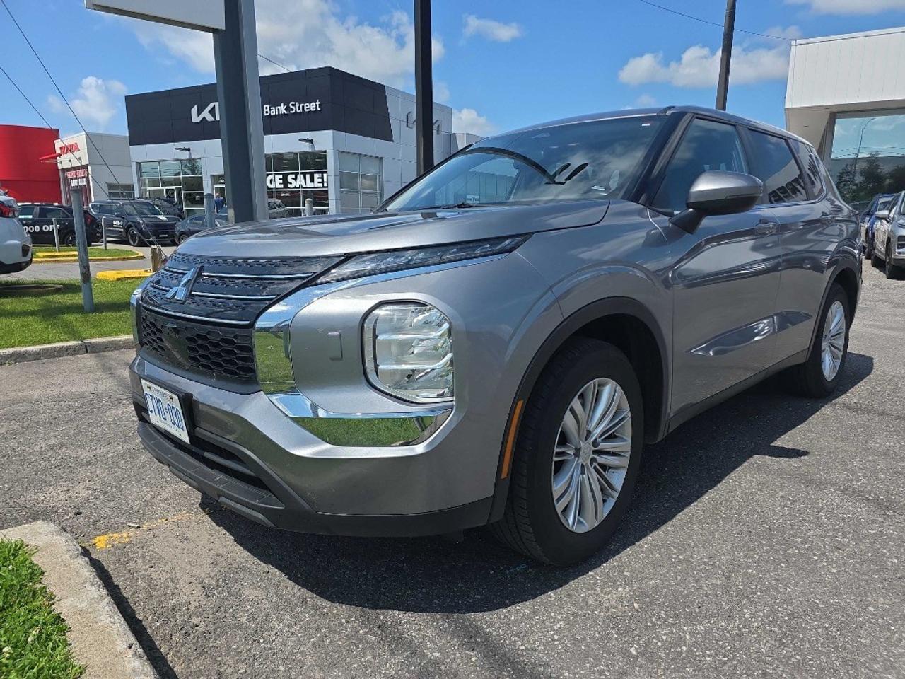 Balance of 5 year/100,000kms BASIC warranty and 10 year/160,000kms Factory Powertrain Warranty on ALL MITSUBISHI products! Best in the industry!!!! Experience the impressive 2022 Mitsubishi Outlander ES S-AWC, presented in a sophisticated gray finish with a dependable 4×4 drivetrain. This SUV delivers a confident driving experience and superb handling across various terrains. On the outside, the Outlander showcases stylish alloy wheels that complement its commanding presence. Inside, youll enjoy a thoughtfully appointed interior with features designed to enhance your driving comfort, including heated front seats and a leather/metal-look gear shifter material. The third row means that ample space is a given, while power windows and keyless entry add to the convenient experience. Stay connected and entertained with smart device integration, a Bluetooth connection, and satellite radio. Safety is prioritized with a suite of driver assistance technologies such as lane assist, parking sensors, and a backup camera. Feel at ease with brake assist and all the essential conveniences like heated mirrors. This vehicle is perfect for families or adventure seekers who need reliability and practicality without sacrificing style and innovation. Contact Bank Street Mitsubishi today for more information, and get ready to take the Outlander ES S-AWC for a spin!