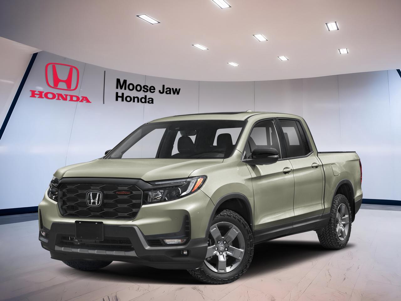 Built for work, weekends, and every season in Saskatchewan, the brand new 2026 Honda Ridgeline Trailsport brings proven V6 power, all-wheel-drive confidence, and smart pickup versatility to Moose Jaw roads. Finished in Green, this 2026 Honda Ridgeline Trailsport pairs rugged style with everyday ease, making it a practical truck for drivers who want comfort, capability, and trusted Honda engineering.

FEATURES OF THE Ridgeline Trailsport

»» Trail-ready all-wheel drive for added confidence
»» Raised toughness with off-road focused design
»» Durable pickup versatility for daily use
»» V6 power for smooth strong response

TRUCK FEATURES

»» Tows up to 2,268 kilograms confidently
»» Lockable in-bed trunk adds secure storage
»» Dual-action tailgate boosts loading flexibility
»» Truck bed built for active lifestyles

ADVANCED SAFETY FEATURES

»» Honda Sensing suite supports safer driving
»» Collision mitigation braking can help react
»» Lane keeping assist helps maintain position
»» Road departure mitigation adds extra support

PERFORMANCE AND EFFICIENCY

»» 3.5-litre i-VTEC V6 delivers strong power
»» 9-speed automatic supports smooth shifting
»» All-wheel drive improves year-round traction
»» Independent suspension helps stable road manners

COMFORT AND CONVENIENCE

»» Spacious cabin offers excellent daily comfort
»» Four full doors ease passenger access
»» Dual-action tailgate simplifies cargo loading
»» Smart interior storage keeps items organized

TECHNOLOGY AND CONNECTIVITY

»» Easy-to-use infotainment supports daily driving
»» Clear driver display shares key information
»» Steering-wheel controls improve convenience on road
»» Modern connectivity helps keep devices paired

CARGO SPACE

»» Composite bed resists dents and corrosion
»» In-bed trunk stores gear out of sight
»» Wide bed suits bulky everyday cargo
»» Flexible rear space supports extra hauling

WHAT OTHER OWNERS LIKE

»» Smooth V6 power for easy driving
»» Comfortable ride uncommon in many trucks
»» Clever bed trunk adds real usefulness
»» All-wheel drive inspires winter confidence

The 2026 Honda Ridgeline Trailsport stands out by blending pickup strength with the comfort and control many drivers want for daily life. Its 3.5-litre 24-valve SOHC i-VTEC V6 works with a 9-Speed Automatic transmission for smooth response, while traction intégrale, translated as all-wheel drive, helps deliver secure footing on pavement, gravel, and snowy roads.

This brand new 2026 Honda Ridgeline Trailsport is a smart fit for busy families, outdoor enthusiasts, and jobsite commuters alike. The cabin is roomy and easy to live with, and the truck bed adds true utility without making the drive feel harsh or cumbersome. It is a pickup designed to make hard tasks easier.

In Moose Jaw, changing weather and mixed road conditions demand confidence. The 2026 Honda Ridgeline Trailsport answers with strong traction, predictable handling, and practical truck details that support real ownership needs. From errands around town to highway trips and weekend gear hauling, it delivers balanced capability with a refined feel behind the wheel.

At Moose Jaw Honda, this new Ridgeline is ready for drivers who want a truck that feels modern, useful, and dependable. Its Green exterior gives it a fresh, outdoors-ready look, while its proven layout supports both work and recreation. If you want a midsize pickup with real versatility and everyday comfort, this Honda deserves a close look.

This 2026 Honda Ridgeline Trailsports VIN is: 5FPYK3F6XTB501629.<p> and trusted Honda engineering.

FEATURES OF THE Ridgeline Trailsport

»» Trail-ready all-wheel drive for added confidence
»» Raised toughness with off-road focused design
»» Durable pickup versatility for daily use
»» V6 power for smooth strong response

TRUCK FEATURES

»» Tows up to 2</p>
<p>268 kilograms confidently
»» Lockable in-bed trunk adds secure storage
»» Dual-action tailgate boosts loading flexibility
»» Truck bed built for active lifestyles

ADVANCED SAFETY FEATURES

»» Honda Sensing suite supports safer driving
»» Collision mitigation braking can help react
»» Lane keeping assist helps maintain position
»» Road departure mitigation adds extra support

PERFORMANCE AND EFFICIENCY

»» 3.5-litre i-VTEC V6 delivers strong power
»» 9-speed automatic supports smooth shifting
»» All-wheel drive improves year-round traction
»» Independent suspension helps stable road manners

COMFORT AND CONVENIENCE

»» Spacious cabin offers excellent daily comfort
»» Four full doors ease passenger access
»» Dual-action tailgate simplifies cargo loading
»» Smart interior storage keeps items organized

TECHNOLOGY AND CONNECTIVITY

»» Easy-to-use infotainment supports daily driving
»» Clear driver display shares key information
»» Steering-wheel controls improve convenience on road
»» Modern connectivity helps keep devices paired

CARGO SPACE

»» Composite bed resists dents and corrosion
»» In-bed trunk stores gear out of sight
»» Wide bed suits bulky everyday cargo
»» Flexible rear space supports extra hauling

WHAT OTHER OWNERS LIKE

»» Smooth V6 power for easy driving
»» Comfortable ride uncommon in many trucks
»» Clever bed trunk adds real usefulness
»» All-wheel drive inspires winter confidence

The 2026 Honda Ridgeline Trailsport stands out by blending pickup strength with the comfort and control many drivers want for daily life. Its 3.5-litre 24-valve SOHC i-VTEC V6 works with a 9-Speed Automatic transmission for smooth response</p>
<p> and the truck bed adds true utility without making the drive feel harsh or cumbersome. It is a pickup designed to make hard tasks easier.

In Moose Jaw</p>
<p> changing weather and mixed road conditions demand confidence. The 2026 Honda Ridgeline Trailsport answers with strong traction</p>
<p> and practical truck details that support real ownership needs. From errands around town to highway trips and weekend gear hauling</p>
<p> while its proven layout supports both work and recreation. If you want a midsize pickup with real versatility and everyday comfort</p>
<p> this Honda deserves a close look.

This 2026 Honda Ridgeline Trailsports VIN is: 5FPYK3F6XTB501629.</p>