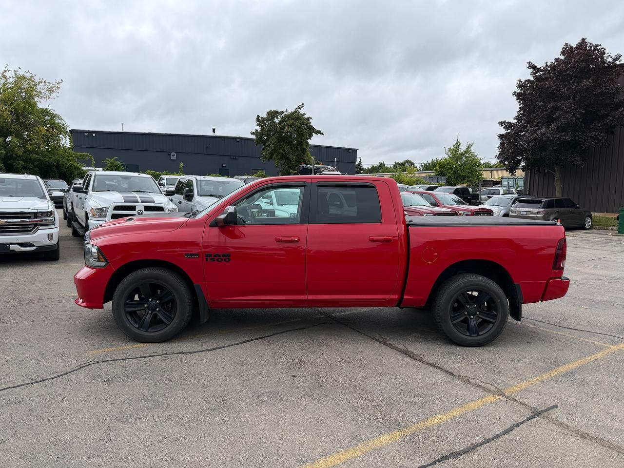 2017 RAM 1500 4WD CREW CAB 140.5" SPORT NIGHT - Stk# 323A Photo