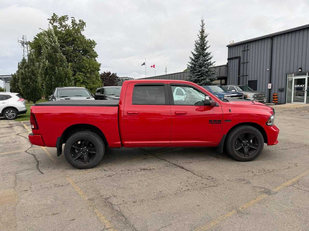2017 RAM 1500 4WD CREW CAB 140.5" SPORT NIGHT - Stk# 323A Photo