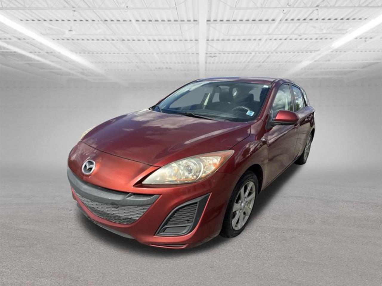 Just added to our AS IS section (wholesale to the public).Buy it before it hits the auction at a wholesale price plus admin fee and taxes.Please note: Not Motor Vehicle Inspected (MVI) No warrantyWe do provide a vehicle check on these vehicles to give you an idea of the work required for MVI, however, buyer is responsible to confirm required repairs.Only on the lot for a limited time, do not miss out.Please note: We only sell to retail customers, no dealers pleaseTRADE INS ARE WELCOME.This 2011 Mazda Mazda3 GX is an economical compact car that delivers an enjoyable driving experience without sacrificing comfort or practicality. Known for its sporty handling, excellent fuel efficiency, and long-lasting reliability, the Mazda3 is an ideal choice for commuters, students, or anyone looking for affordable transportation.Powered by an efficient 4-cylinder engine and paired with a smooth transmission, this Mazda3 offers responsive performance and confidence on the road. The well-designed interior provides comfortable seating, easy-to-use controls, and ample space for both passengers and cargo.With its sleek styling, solid safety features, and reputation for durability, the Mazda3 GX continues to be one of the most popular compact cars in its class. Whether youre driving around town or heading out on a road trip, this vehicle delivers exceptional value and dependability.Key Features:Fuel-Efficient 4-Cylinder EngineAutomatic TransmissionAM/FM/CD Audio SystemAuxiliary Audio InputPower SteeringPower Door LocksTilt & Telescopic Steering WheelSplit-Folding Rear SeatsSpacious TrunkExcellent Fuel EconomyProven Mazda ReliabilityA practical, comfortable, and budget-friendly vehicle thats ready for its next owner. Contact us today for more information or to schedule a test drive.
