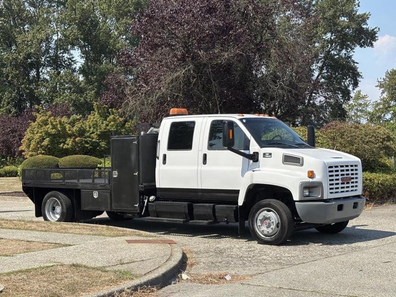 This 2005 GMC C7500 TopKick is powered by an 8.1L V8 gasoline engine paired with an automatic transmission and two-wheel drive. Equipped with a commercial flat deck and integrated utility storage, this medium-duty truck is suited for contractors, municipalities, equipment transport, maintenance operations, and commercial fleet applications.

The flat deck measures approximately 9 feet 4 inches long by 7 feet 9 inches wide, providing an open cargo platform for transporting tools, equipment, materials, and supplies. The truck is also equipped with utility cabinets for organized storage, a pintle trailer hitch, and a beacon light.

Additional features include heated mirrors, power windows, AM/FM radio, and fan and heat for operator comfort.

Overall vehicle dimensions are approximately 24 feet 6 inches long, 8 feet wide, and 8 feet 3 inches high.

Finished in white with a gray leather interior, this GMC C7500 TopKick provides a versatile medium-duty flat deck platform with integrated storage and towing capability for a variety of commercial and fleet applications. This item is currently OFFSITE. You must register an appointment with our office to schedule an offsite viewing. Appointments must be made a minimum of one business day in advance (and as defined by the days that Repo.com is open for business) before your appointment can be scheduled and confirmed. We may, at our own discretion, instead opt to transport smaller items to Repo.coms main yard for viewing purposes.  $39,820.00 plus $375 processing fee, $40,195.00 total payment obligation before taxes.   Listing report, warranty, contract commitment cancellation fee. All above specifications and information is considered to be accurate but is not guaranteed and no opinion or advice is given as to whether this item should be purchased. We do not allow test drives due to theft, fraud, acts of vandalism and undetectable impaired driving. Instead we provide the following benefits: Complimentary Warranty (with options to extend), Limited Money Back Satisfaction Guarantee on Fully Completed Contracts, Contract Commitment Cancellation, and an Open-Ended Sell-Back Option. Ask seller for details or call 604-522-REPO(7376) to confirm listing availability.