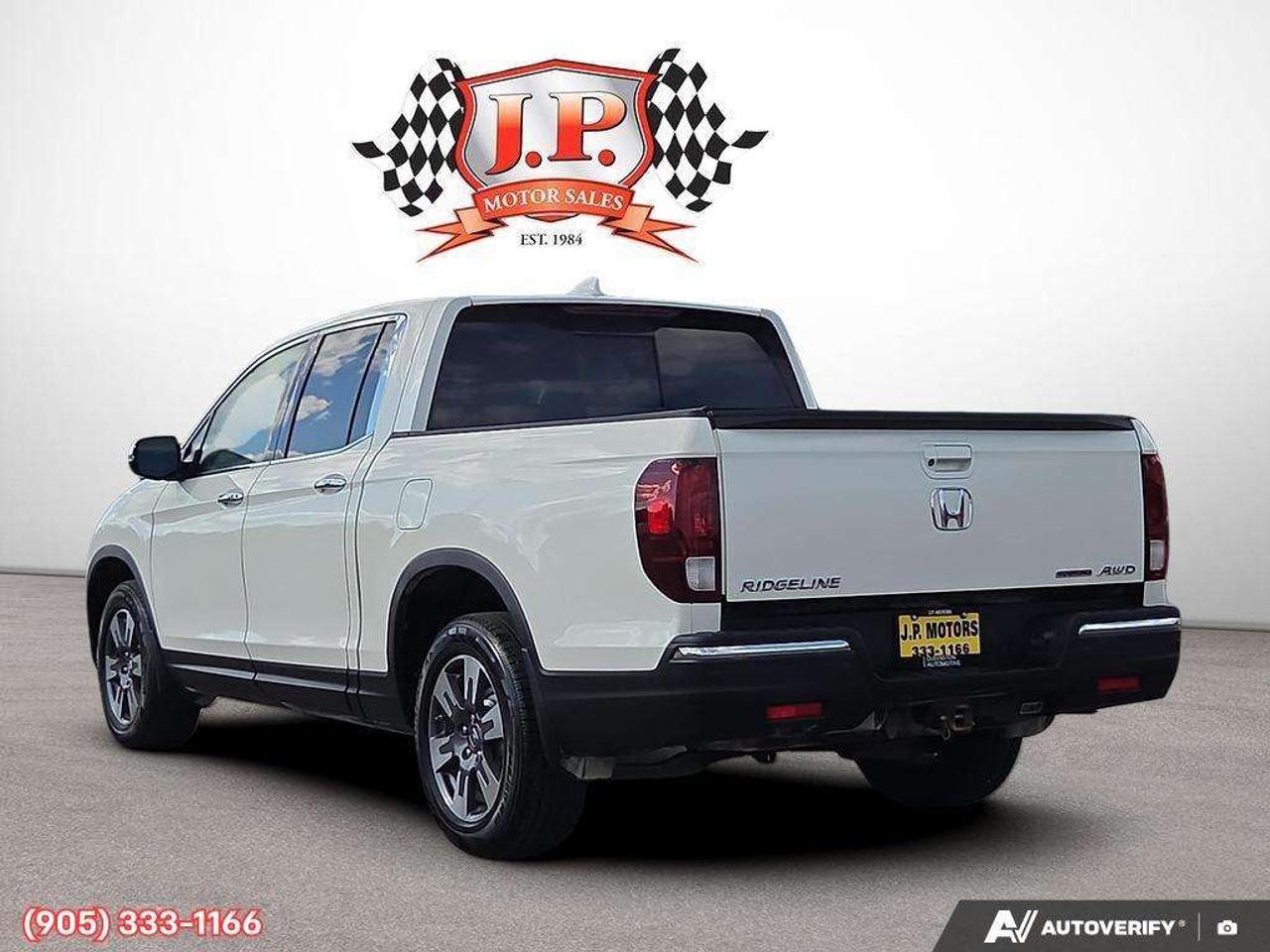 2019 Honda Ridgeline Touring Apple CarPlay & Android Auto • Power Sunroof • Heated & Cooled Seats • Remote Start System • Navigation System • Photo