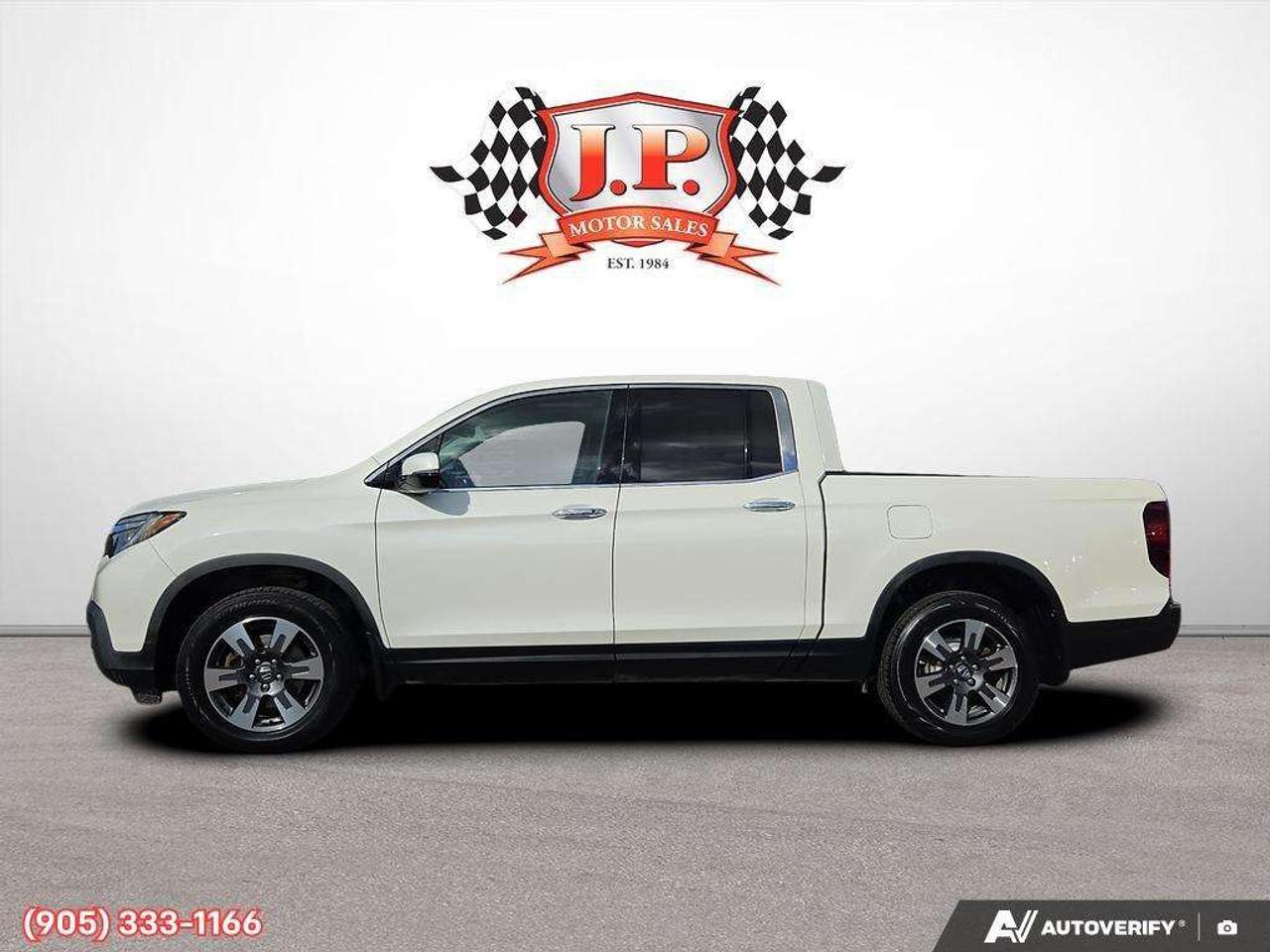 2019 Honda Ridgeline Touring Apple CarPlay & Android Auto • Power Sunroof • Heated & Cooled Seats • Remote Start System • Navigation System • Photo