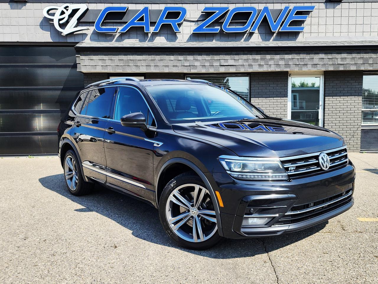 <p>Discover adventure and sophisticated style in this pre-owned 2019 Volkswagen Tiguan Highline 4MOTION, now available at Car Zone. Dressed in a striking blue exterior and complemented by a sleek black interior, this Tiguan is ready to turn heads on every journey. Its versatile SUV/Crossover body style makes it perfect for navigating busy city streets or embarking on weekend getaways, all while offering the robust capability of all-wheel drive. Under the hood, youll find a responsive 2L I4 Turbo engine paired with a smooth automatic transmission, delivering an engaging and efficient driving experience. With just 117,142 km on the odometer, this Tiguan is poised to offer many more miles of comfortable and capable driving.</p><p>This 2019 Volkswagen Tiguan Highline 4MOTION is loaded with features designed to elevate your driving experience. For those seeking a confident ride in any Canadian weather, the <strong>4MOTION All-Wheel Drive system</strong> provides exceptional traction and stability, ensuring youre prepared for whatever the road throws your way. Inside, youll find a premium cabin highlighted by luxurious <strong>leather seating</strong>, offering both comfort and a touch of elegance for every drive. Stay connected and entertained on the go with the advanced <strong>infotainment system</strong>, featuring a user-friendly touchscreen interface. The <strong>panoramic sunroof</strong> opens up the cabin, bathing it in natural light and providing breathtaking views, making every trip feel more expansive and enjoyable. Finally, experience peace of mind with the suite of <strong>advanced safety features</strong> designed to protect you and your passengers.</p><p>Looking for Your Dream Car? Call Car Zone Today!</p><p>Thanks for viewing our Car Zone inventory. All of our vehicles come fully detailed with a Carfax and a mechanical fitness assessment. Drive this home today! Easy financing options. All credit welcome.&nbsp;<strong><a href=http://www.carzonecalgary.ca/finance>APPLY NOW</a>&nbsp;</strong>We even take trades. Same day approvals at&nbsp;<a href=http://www.carzonecalgary.ca/><strong>CARZONECALGARY</strong></a> or visit us in person at 2036 36 Street SE Calgary for a hassle free test drive. Let our friendly team of experts book an appointment with you and show you the Car Zone difference! AMVIC licensed dealer.&nbsp;</p>