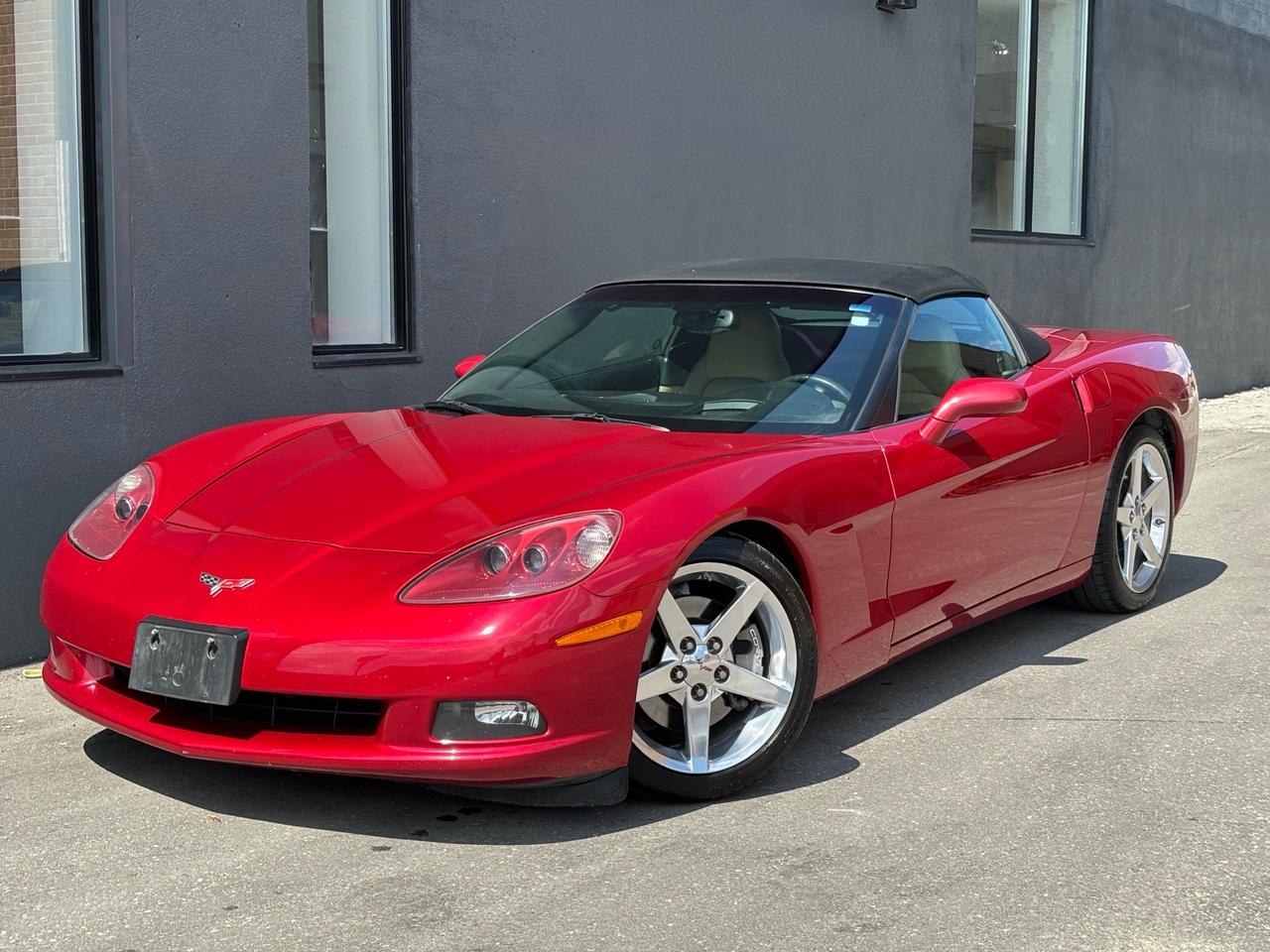 <p><br></p><p><span>Turn heads everywhere you go in this stunning 2005 Chevrolet Corvette Convertible, featuring the highly desirable 6-speed manual transmission and just 94,000 original kilometres!</span></p><p><span><br></span></p><p><span>Finished in gorgeous Magnetic Red Metallic II over a beautiful Tan leather interior, this C6 Corvette delivers the perfect combination of timeless styling, exhilarating performance, and classic American sports-car character.</span></p><p><span>Mature elderly couple owned, meticulously cared for, completely stock and unmodified, and proudly showing NO ACCIDENTS. This is a Corvette that has been enjoyed and preserved the right way.</span></p><p><span>Under the hood is Chevrolets legendary 6.0L LS2 V8, producing 400 horsepower and 400 lb-ft of torque, paired with the sought-after 6-speed manual transmission. The C6s lightweight construction, rear-wheel drive, independent suspension, four-wheel disc brakes with ABS, traction control, and performance-focused chassis make every drive an experience.</span></p><p><span><br></span></p><p><span>Drop the power-operated soft top at the push of a button and enjoy open-air cruising, while the Tan leather interior adds a refined touch. Features include power leather seats, dual-zone automatic climate control, keyless entry, power windows and locks, cruise control, tilt/telescopic steering, driver information centre, premium audio, steering-wheel controls, automatic headlights, and Corvettes iconic dual-cockpit design.</span></p><p><span>Outside, the Corvette features factory alloy wheels, performance tires, dual exhaust, HID headlights, fog lamps, and the unmistakable low-slung C6 styling that still looks incredible today.</span></p><p><span>With only 94,000 km, a clean accident-free history, desirable 6-speed manual, gorgeous Magnetic Red Metallic II paint, Tan leather interior, and a completely stock configuration, this is the kind of C6 Corvette that is becoming increasingly difficult to find.</span></p><p><span><span id=jodit-selection_marker_1787151544070_823223795012178 style=line-height: 0; display: none; data-jodit-selection_marker=start></span><br></span></p><p><span>Whether youre looking for a weekend cruiser, summer toy, or a special sports car to enjoy for years to come, this Corvette checks all the boxes: low kilometres, excellent ownership history, incredible colour combination, manual transmission, LS2 V8 power, convertible freedom, and timeless C6 appeal.</span></p><p><span>A beautiful, honest, unmolested Corvette that needs to be seen and driven to truly appreciate. Drop the top, fire up the LS2, row through the 6-speed, and experience one of Americas most iconic sports cars.</span></p><p><span><br></span></p><p>FINANCING, GAP INSURANCE & EXTENDED WARRANTIES AVAILABLE ON ALL VEHICLES! </p><br><br><p>COLISEUM AUTO SALES ON WESTON </p><br><p>301 WESTON ROAD </p><br><p>TORONTO, ON M6N 3P1 </p><br><p>4 1 6 - 7 6 6 - 2 2 7 7</p><p><br></p>