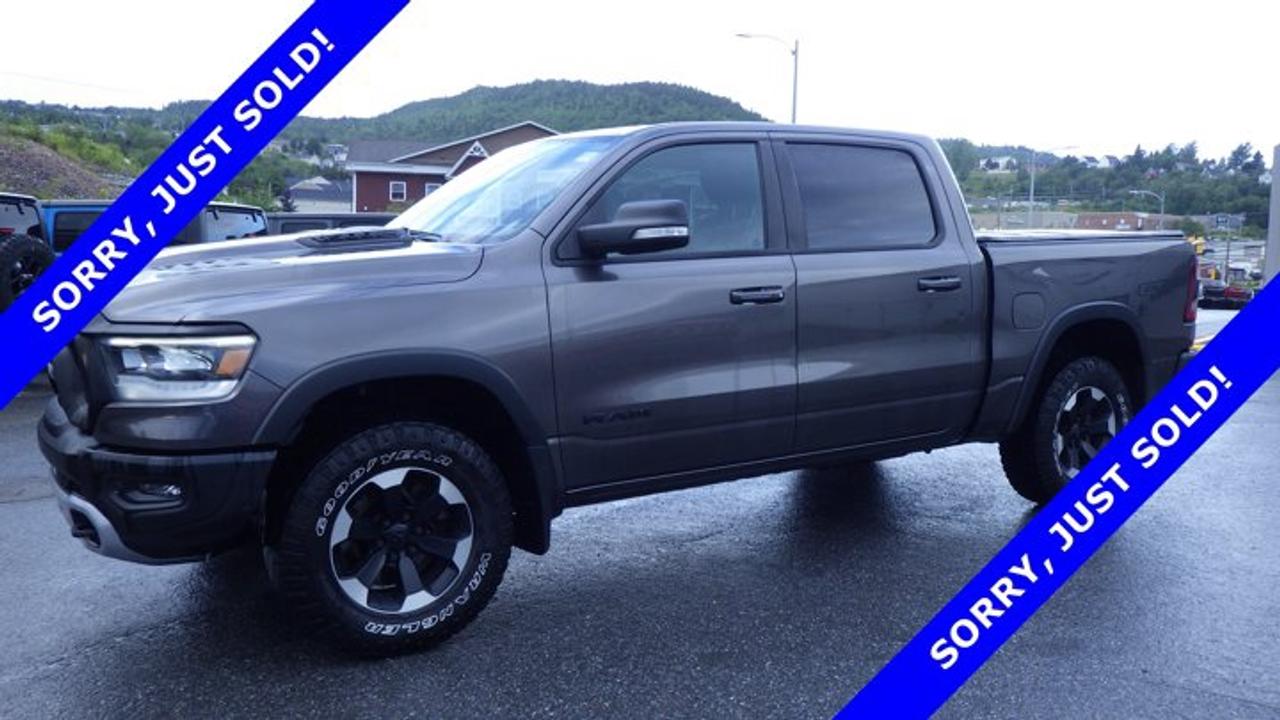 Rebel 4x4 Crew Cab 57 Box, 8-Speed Automatic w/OD, Gas/Electric V-8 5.7 L/345