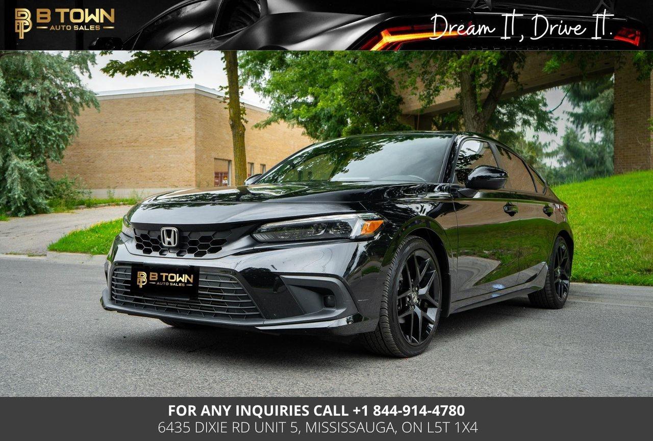 <strong>2023 Honda Civic Hatchback Sport</strong>




<span>Finished in </span><span>Crystal Black Pearl</span><span>, this </span><span>2023 Honda Civic Hatchback Sport</span><span> combines sporty styling, everyday practicality, and Honda&rsquo;s renowned reliability. With its versatile hatchback design, responsive performance, and advanced technology, the Civic Sport is perfect for commuters and driving enthusiasts alike.</span>




<span>Powered by a </span><span>2.0L i-VTEC 4-Cylinder engine producing 158 horsepower and 138 lb-ft of torque</span><span>, paired with a </span><span>Continuously Variable Transmission (CVT)</span><span> featuring paddle shifters, the Civic Hatchback delivers smooth performance, excellent fuel efficiency, and confident handling.</span>




<strong>Key Features & Options</strong>

<ul>
<li><span>2.0L i-VTEC 4-Cylinder Engine</span></li>
<li><span>Continuously Variable Transmission (CVT)</span></li>
<li><span>Front-Wheel Drive</span></li>
<li><span>Sport Drive Mode</span></li>
<li><span>18-Inch Gloss Black Alloy Wheels</span></li>
<li><span>Sport Exterior Styling</span></li>
<li><span>Center-Exit Chrome Exhaust</span></li>
<li><span>LED Headlights & LED Daytime Running Lights</span></li>
<li><span>LED Taillights</span></li>
<li><span>Smart Key with Push-Button Start</span></li>
<li><span>Remote Engine Start</span></li>
<li><span>Heated Front Sport Seats</span></li>
<li><span>Leather-Wrapped Steering Wheel</span></li>
<li><span>Automatic Climate Control</span></li>
<li><span>7-Inch Digital Driver Display</span></li>
<li><span>7-Inch Touchscreen Display</span></li>
<li><span>Apple CarPlay & Android Auto</span></li>
<li><span>Bluetooth Connectivity</span></li>
<li><span>Honda Sensing&reg; Safety Suite</span></li>
<li><span>Adaptive Cruise Control</span></li>
<li><span>Lane Keeping Assist System</span></li>
<li><span>Collision Mitigation Braking System</span></li>
<li><span>Road Departure Mitigation System</span></li>
<li><span>Traffic Sign Recognition</span></li>
<li><span>Multi-Angle Rearview Camera</span></li>
</ul>






<strong>At B-Town Auto Tricity, each vehicle undergoes a comprehensive inspection to ensure exceptional quality and performance. We proudly serve customers across the Greater Toronto Area and beyond, offering competitive financing, trade-ins, and nationwide shipping.</strong>




<strong>$999* FINANCING FEES APPLY.</strong>




<strong>Special Financing Price: $28,488</strong>

<strong>Cash Price: $29,988</strong>




<strong>Thank you for choosing B-Town Auto Tricity.</strong>