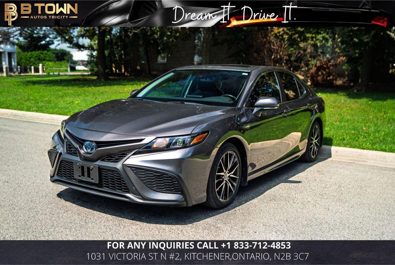 <strong>2023 Toyota Camry Hybrid SE Upgrade</strong>




Finished in a sophisticated finish, this <strong>2023 Toyota Camry Hybrid SE Upgrade</strong> combines sporty styling, outstanding fuel efficiency, and premium comfort in one refined midsize sedan. Featuring the desirable SE Upgrade Package, this Camry offers an engaging driving experience along with advanced technology and Toyotas renowned reliability.




Powered by a <strong>2.5L 4-Cylinder Hybrid Powertrain</strong> producing <strong>208 combined horsepower</strong>, paired with an <strong>Electronic Continuously Variable Transmission (eCVT)</strong> and <strong>Front-Wheel Drive</strong>, the Camry Hybrid delivers smooth acceleration, exceptional fuel economy, and a quiet, comfortable ride. Whether commuting through the city or travelling on the highway, the Camry Hybrid is built to impress.







<strong>Key Features & Factory Options</strong>

&bull; 2.5L 4-Cylinder Hybrid Powertrain &ndash; 208 HP

&bull; Electronic Continuously Variable Transmission (eCVT)

&bull; Front-Wheel Drive (FWD)

&bull; SE Upgrade Package

&bull; SofTex&reg; & Fabric Sport Seats

&bull; Heated Front Seats

&bull; Heated Leather-Wrapped Steering Wheel

&bull; Power Drivers Seat

&bull; Power Moonroof

&bull; Dual-Zone Automatic Climate Control

&bull; Smart Key System with Push-Button Start

&bull; 8-Inch Toyota Multimedia Touchscreen

&bull; Wireless Apple CarPlay&reg; & Android Auto&trade;

&bull; Wireless Phone Charging

&bull; Toyota Safety Sense 2.5+

&bull; Adaptive Cruise Control

&bull; Blind Spot Monitor with Rear Cross Traffic Alert

&bull; Lane Departure Alert with Steering Assist

&bull; Pre-Collision System with Pedestrian Detection

&bull; Rear View Camera

&bull; LED Headlights & LED Daytime Running Lights

&bull; 18-Inch Alloy Wheels




<strong>At B-Town Auto Tricity, each vehicle undergoes a comprehensive inspection to ensure exceptional quality and performance. We proudly serve customers across the Greater Toronto Area and beyond, offering competitive financing, trade-ins, and nationwide shipping.</strong>




<strong><em>$999 FINANCING FEES APPLY.</em></strong>




<strong>Special Financing Price:</strong> $30,888

<strong>Cash Price:</strong> $32,388




<strong>Thank you for choosing B-Town Auto Tricity.</strong>