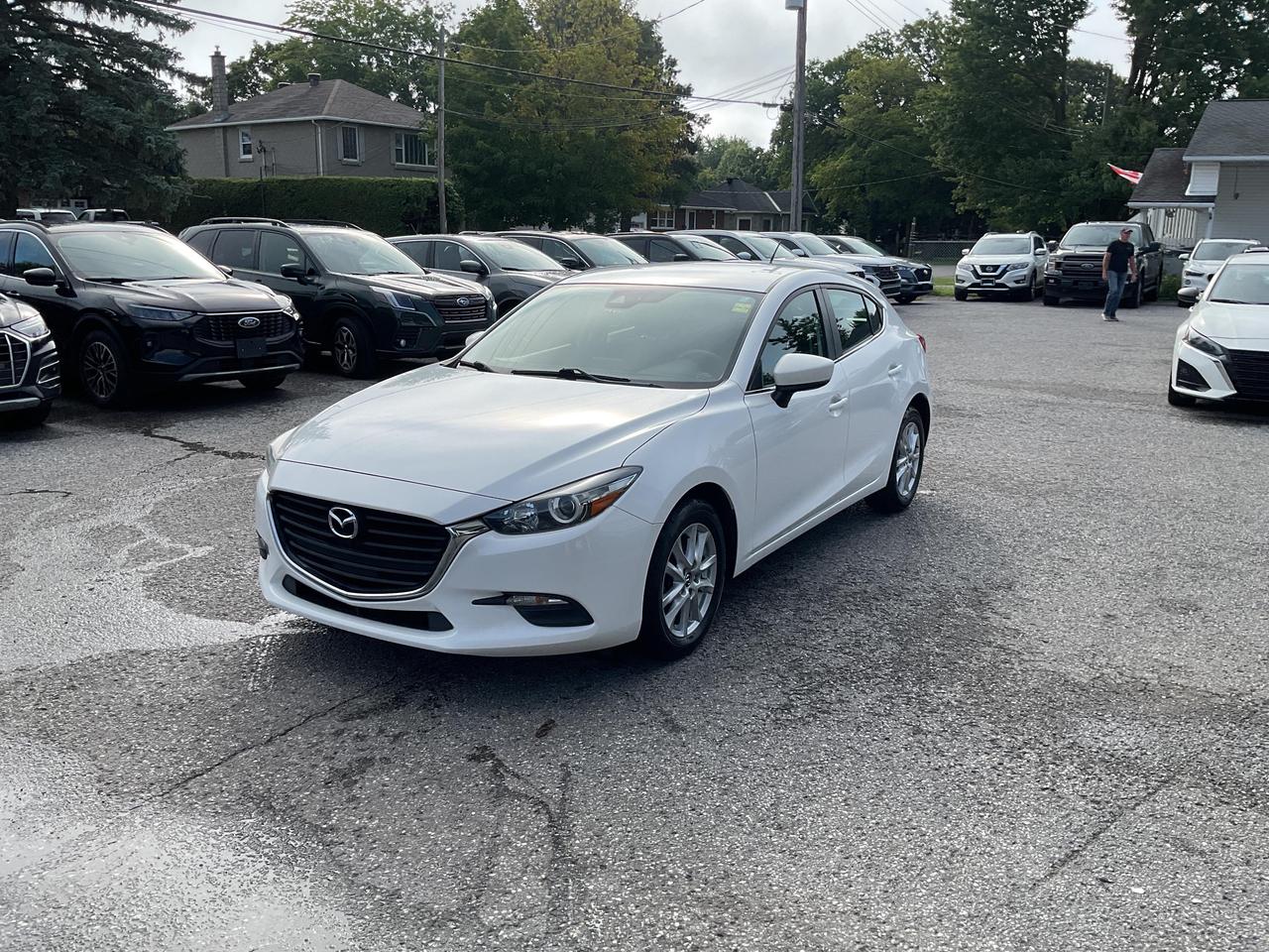 ???? 2.0L 4CYL  MAZDA MAZDA3 SPORT GS 2018  Sporty efficiency meets everyday comfort! ????<br><br>

This reliable front-wheel drive sedan delivers excellent fuel economy and a smooth ride, perfect for daily commutes and weekend adventures. With low mileage and premium features, its ready to go!<br><br>

? Heated Seats<br>
? Backup Camera<br>
? Bluetooth Connectivity<br>
? Air Conditioning<br>
? Cruise Control<br>
? Full Power Group<br><br>

?? NO FEES! <span>(Just pay applicable taxes.)</span><br>
?? LOWEST PRICE GUARANTEED!<br><br>

?? 3 LOCATIONS TO SERVE YOU BETTER:<br>
?? RICHMOND: 1-888-416-2199<br>
?? KINGSTON: 1-888-508-3494<br>
?? NORTH BAY: 1-888-282-3560<br><br>

?? Visit <strong>WWW.MYCAR.CA</strong> to see this MAZDA MAZDA3 and more!<br>
?? Confidence, comfort, and value  all in one! ??