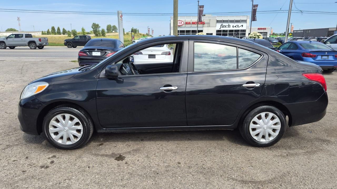 2012 Nissan Versa SV, MANUAL, SEDAN, GREAT ON FUEL, CERTIFIED Photo1